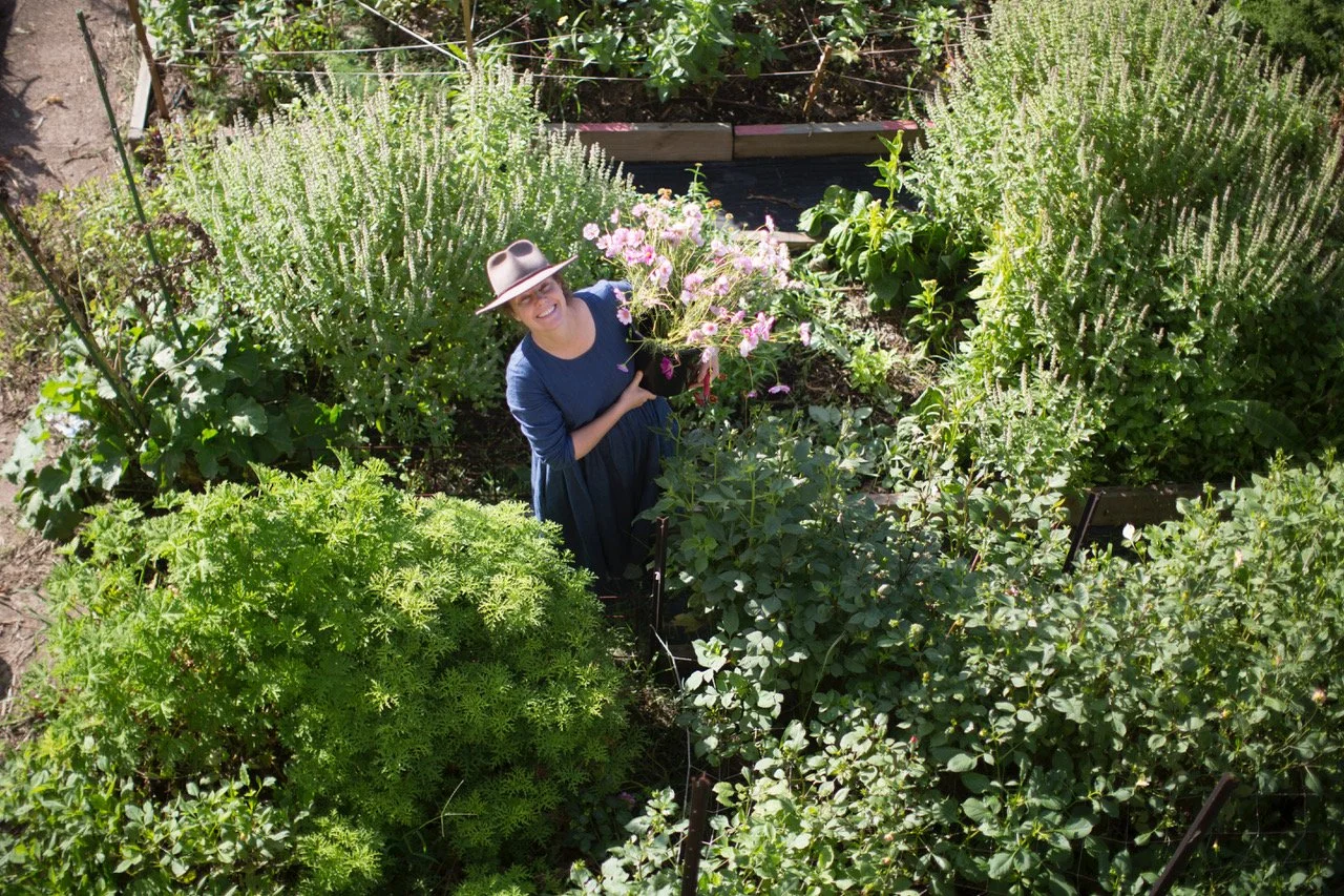 simone in flower farm holding bucket