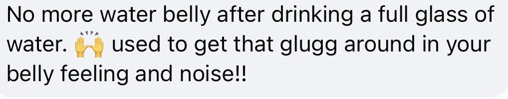 Text message about avoiding water belly after drinking water, with an emoji of two raised hands.