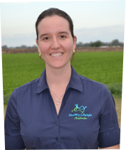 Person wearing a dark polo shirt with a name tag and "Healthy Lifestyles Australia" logo, standing in front of a textured wall.