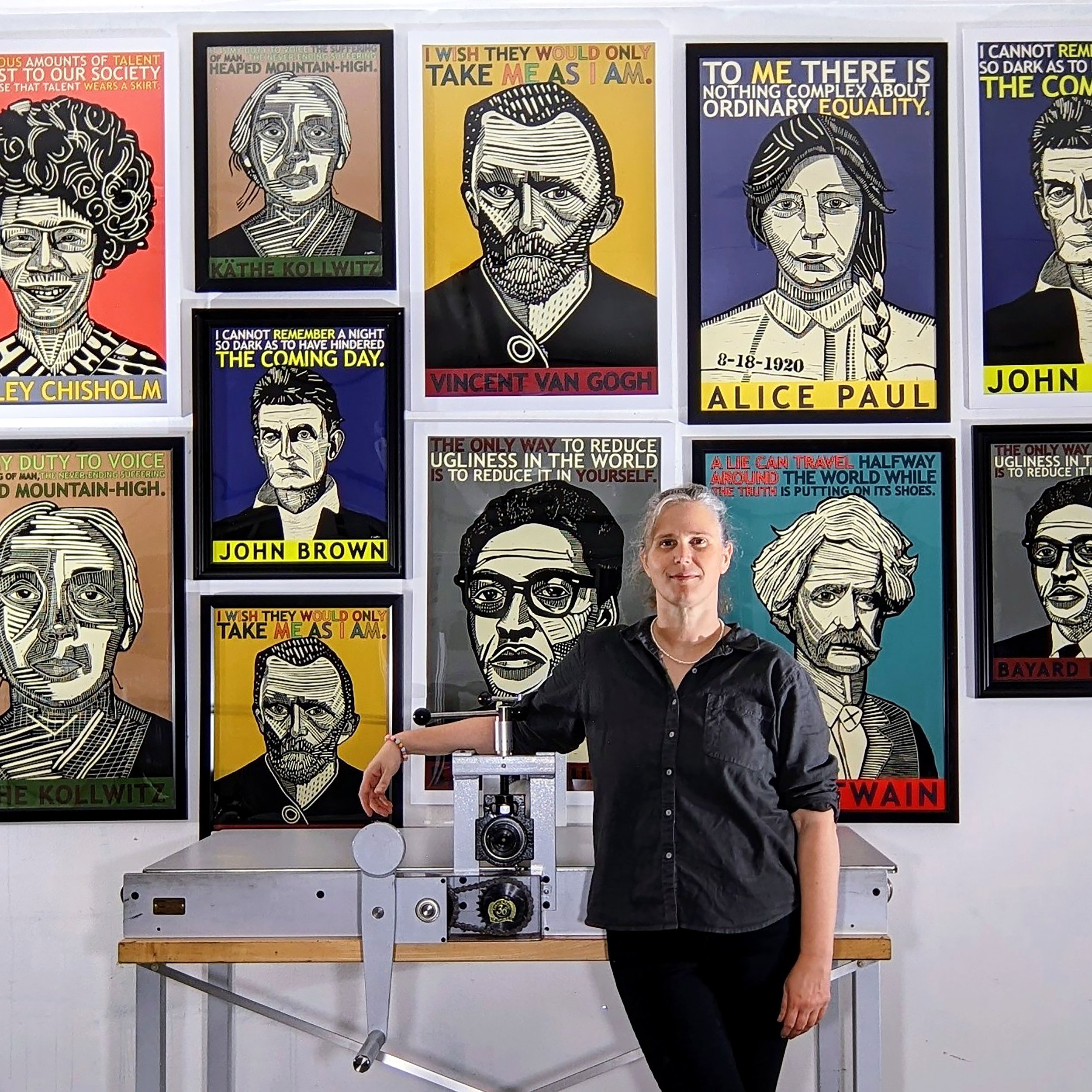 V. Wallace with portrait posters