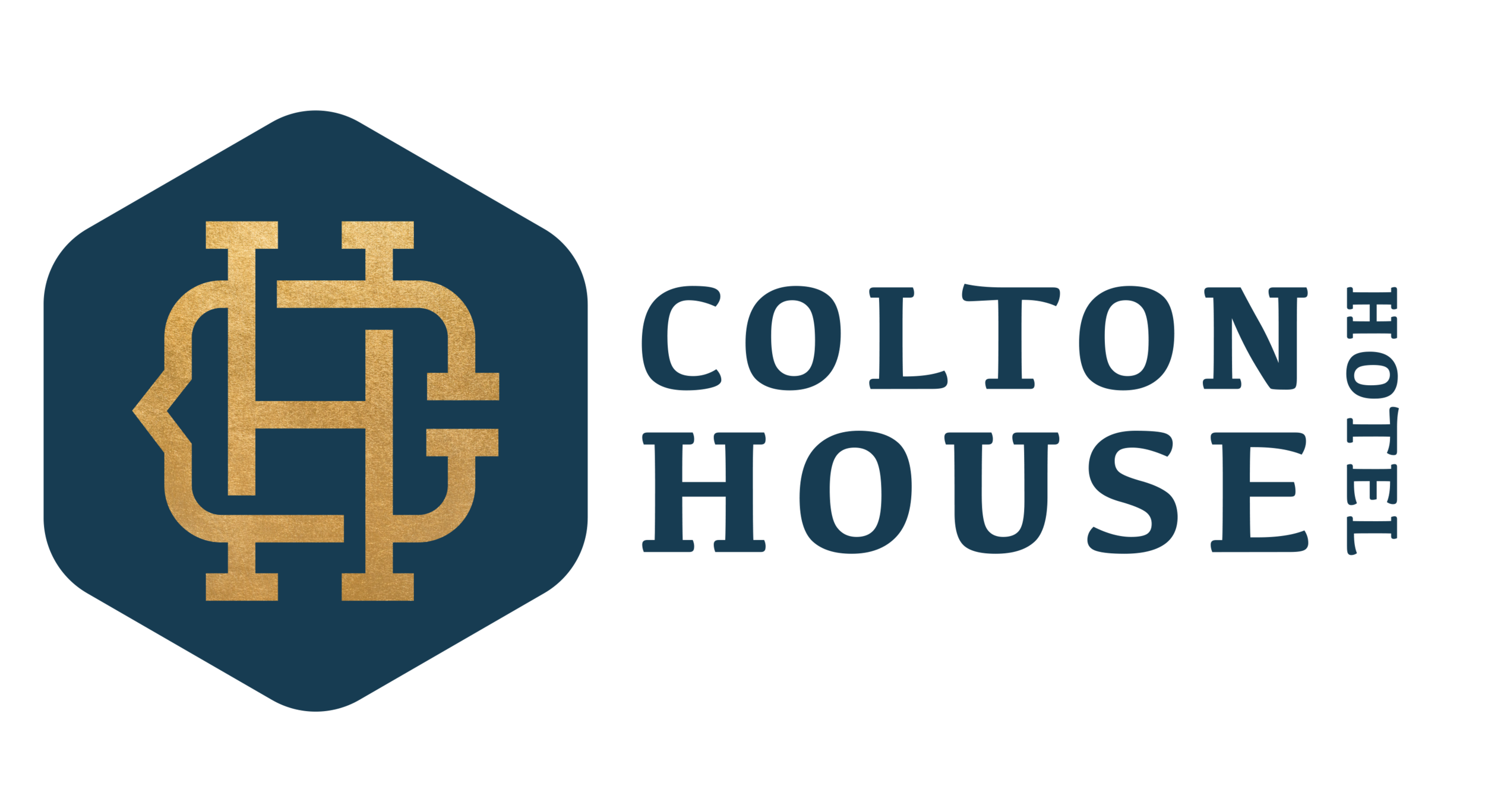 A dark blue hotel key card with a gold logo and gold lettering for 'Hilton.'