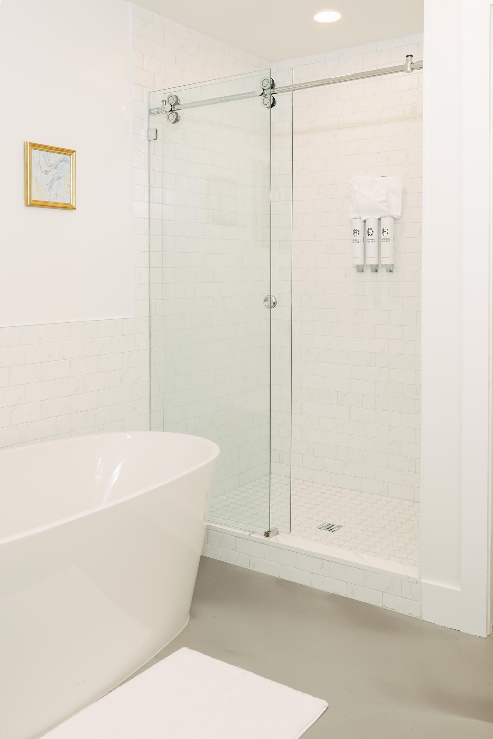 walk-in shower with glass door, soaking tub