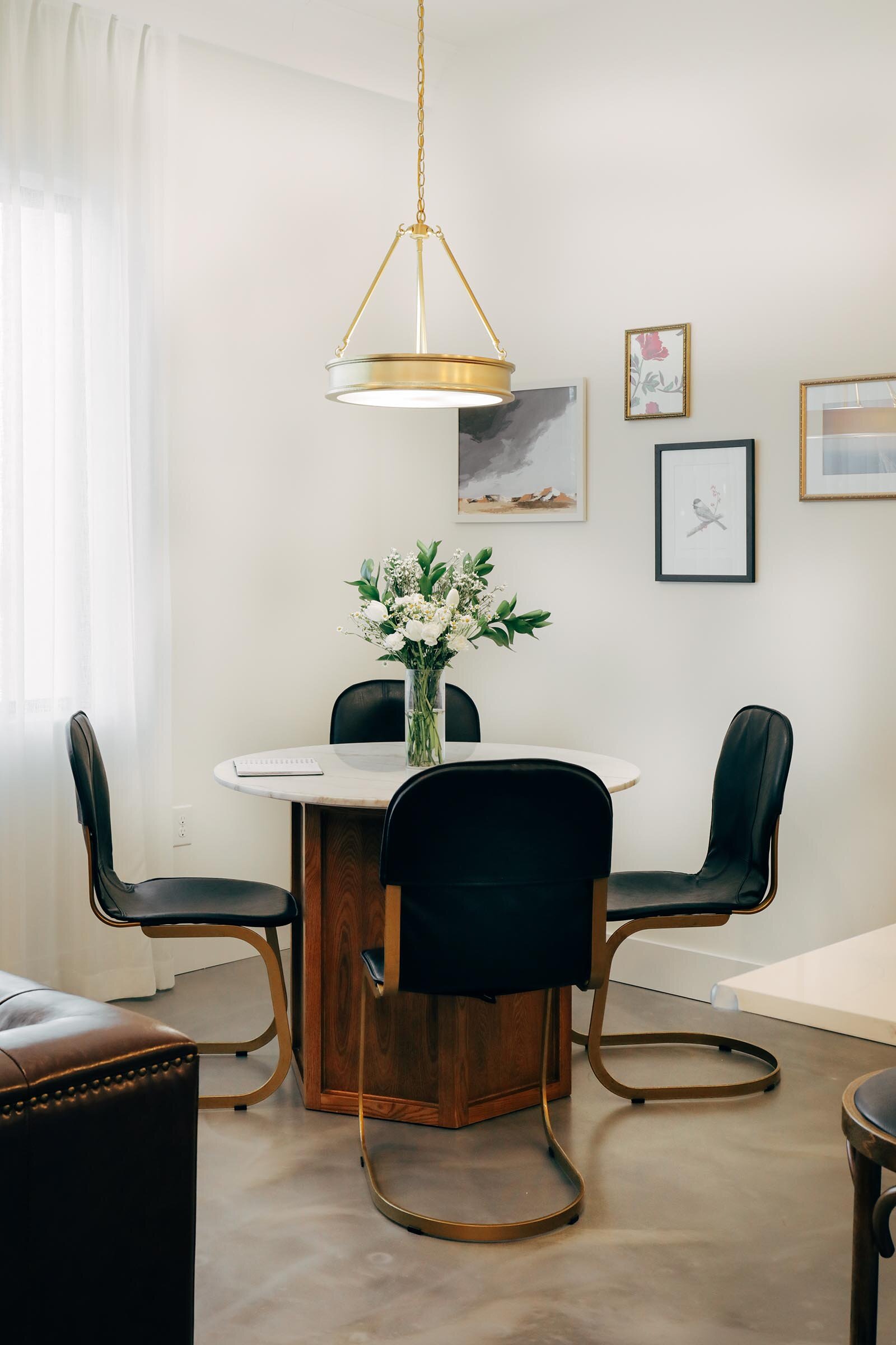 small circular dining table with four chairs 