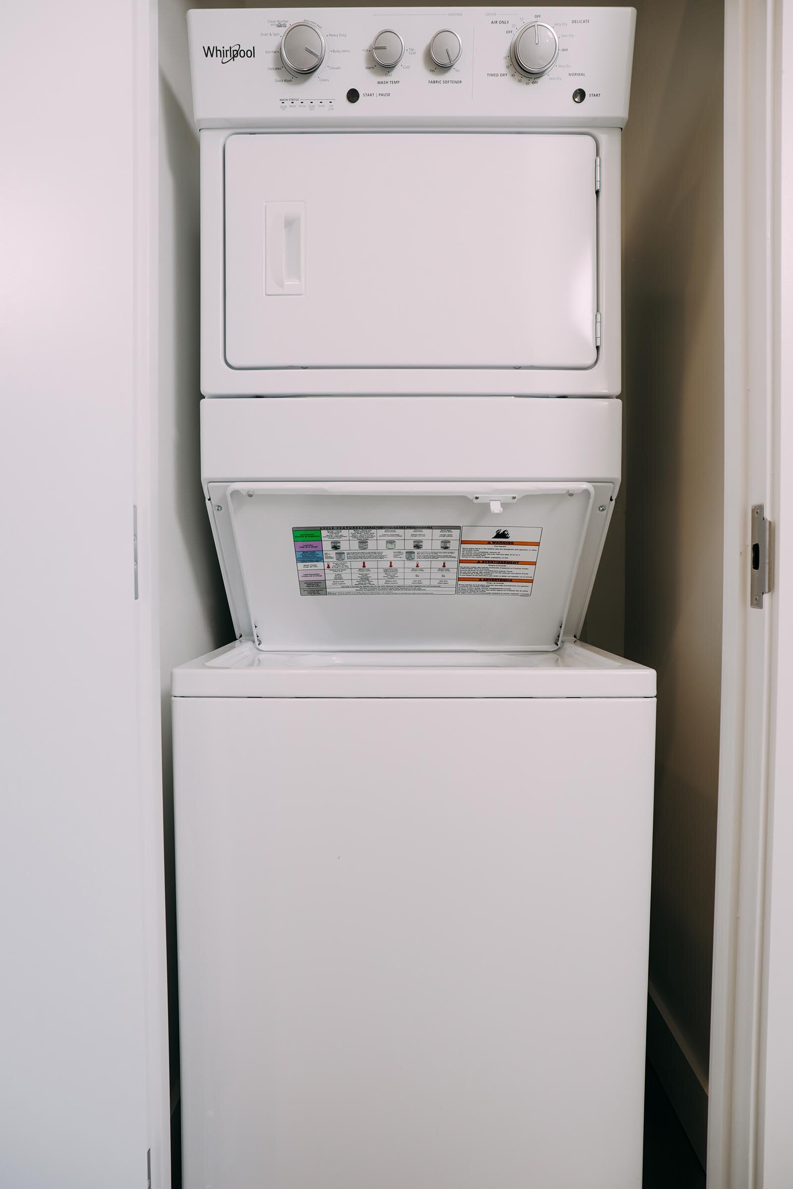 stacked washer/dryer in a closet