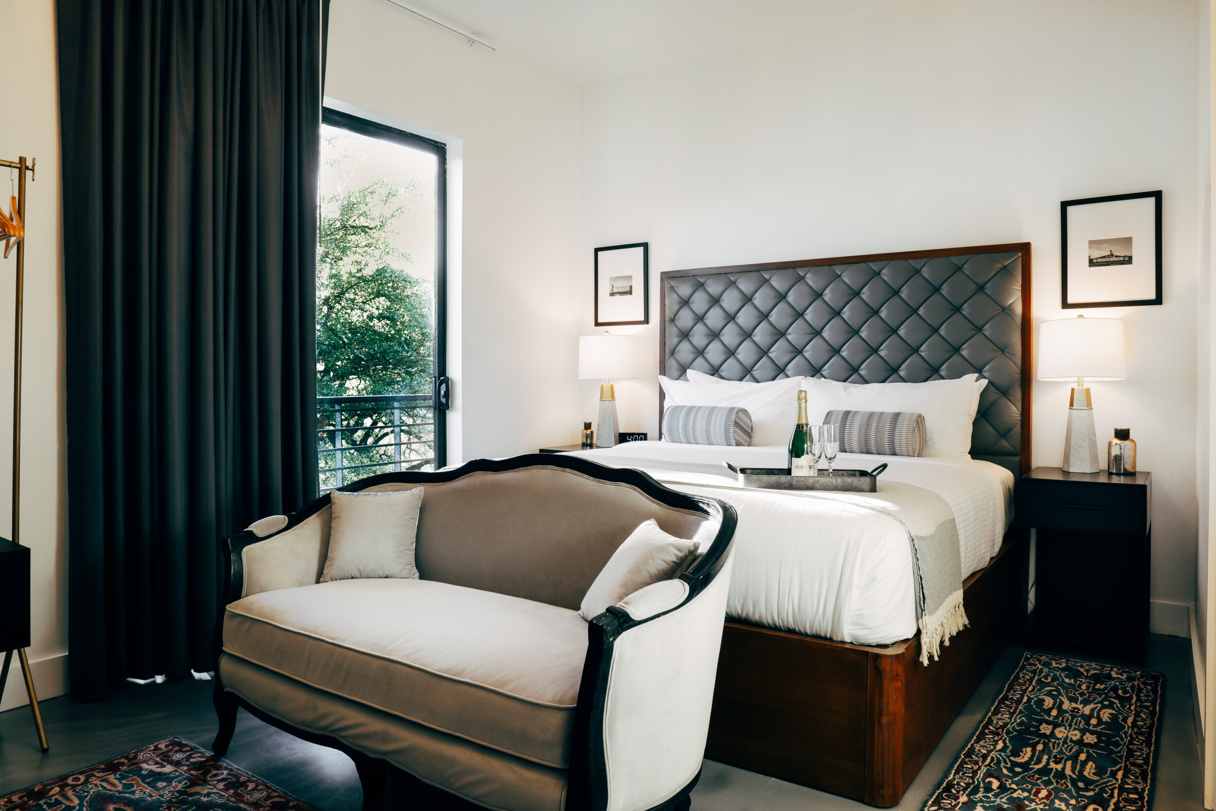 master bedroom with settee at foot of king bed (Copy)
