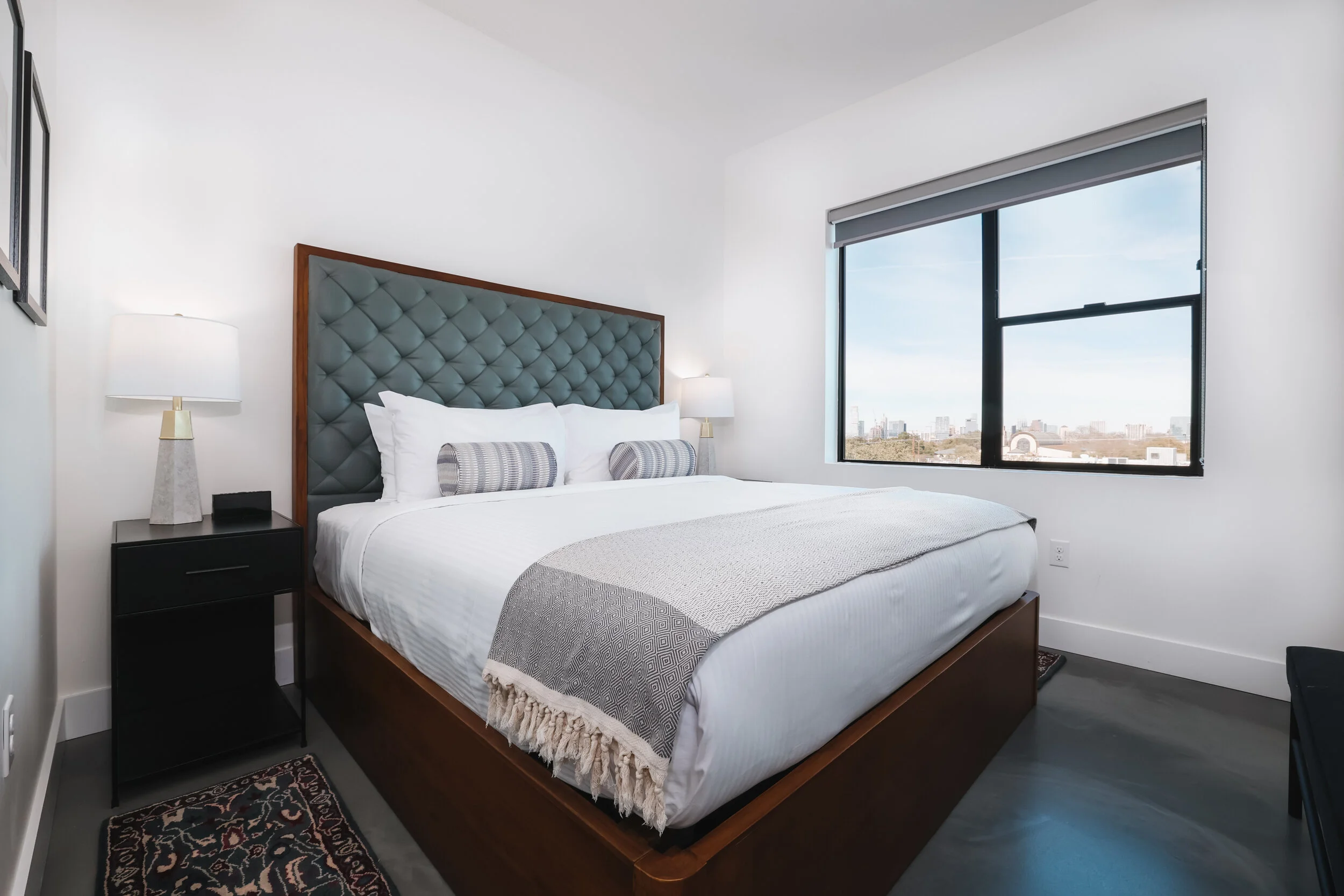 king bed in second bedroom, all white walls