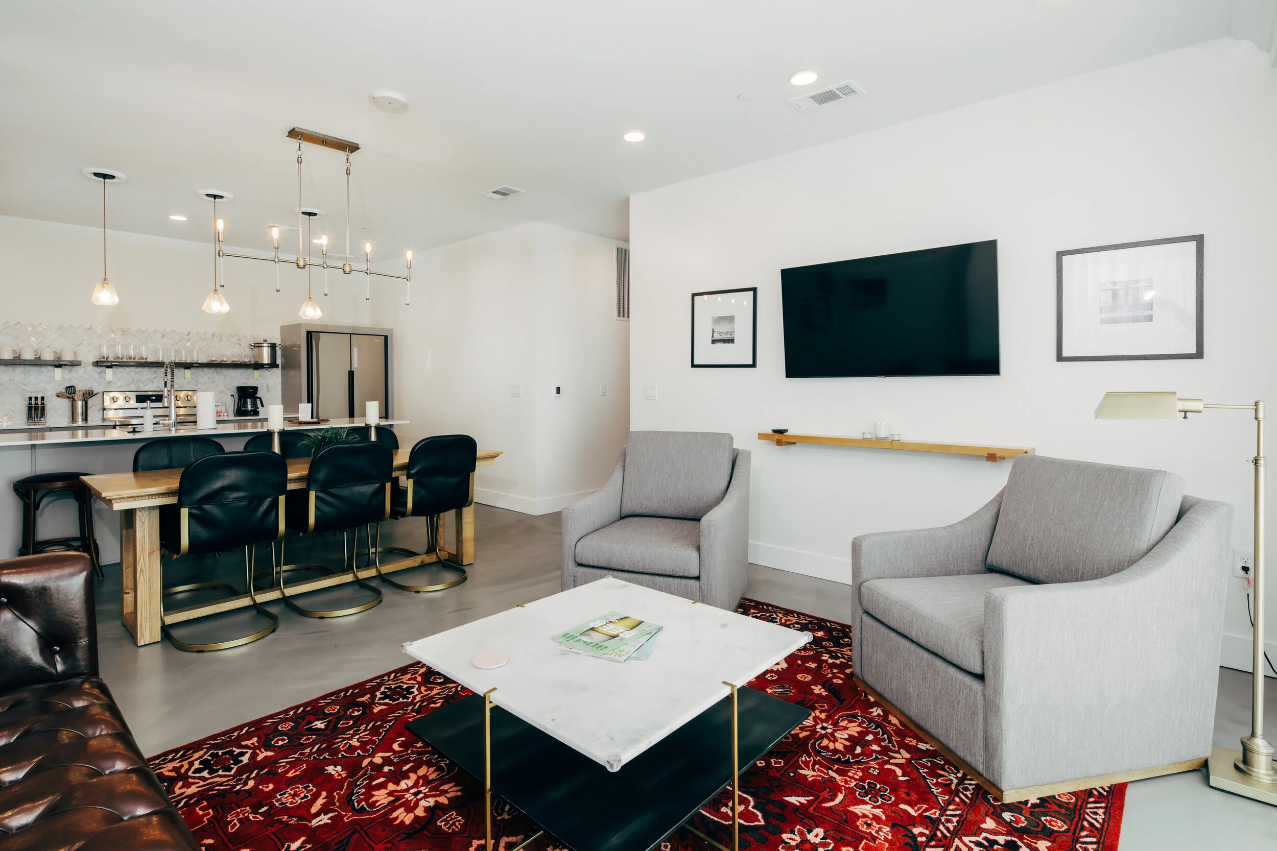 living area, two chairs, coffee table, couch, tv (Copy)