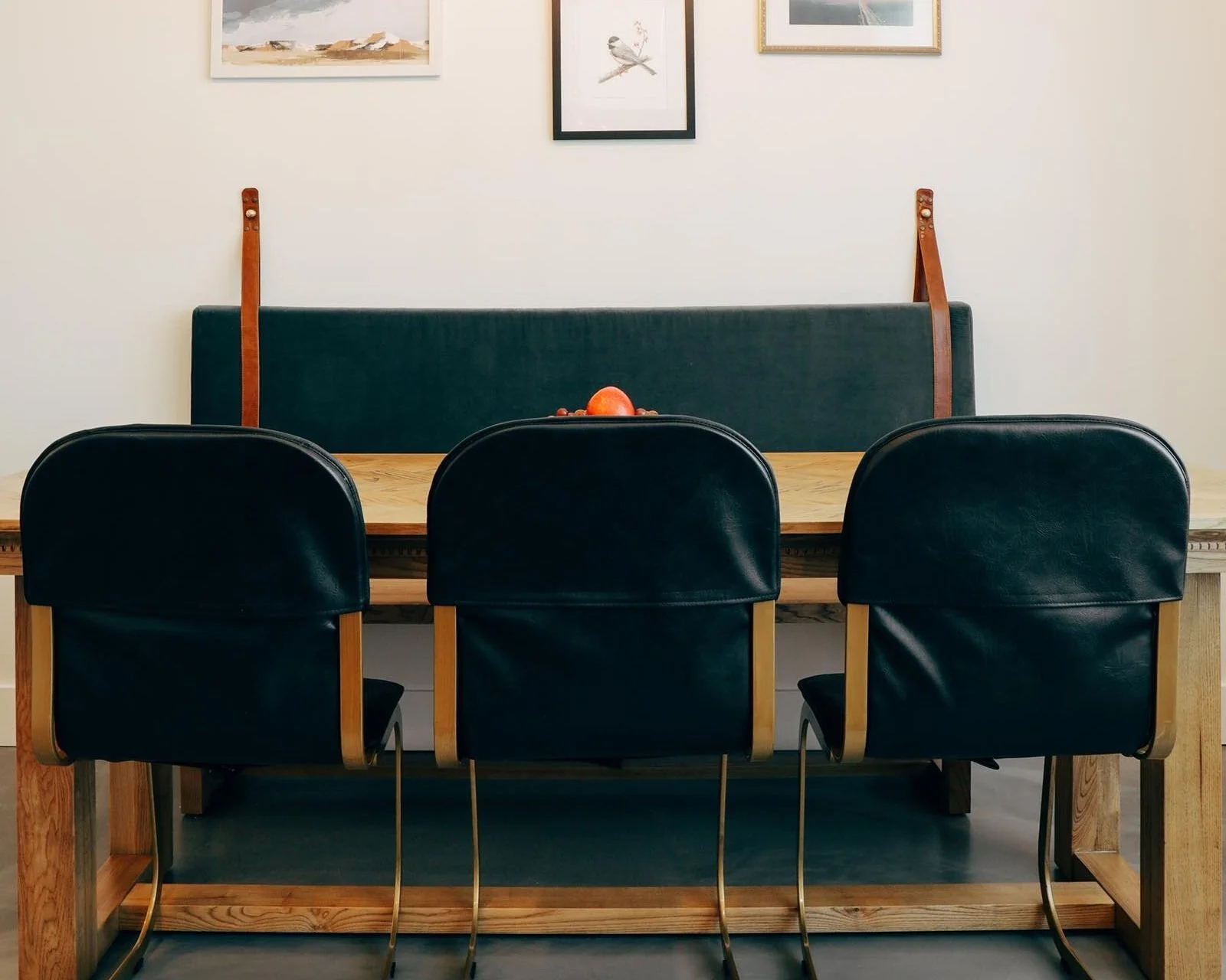 dining table with chairs and bench against the wall