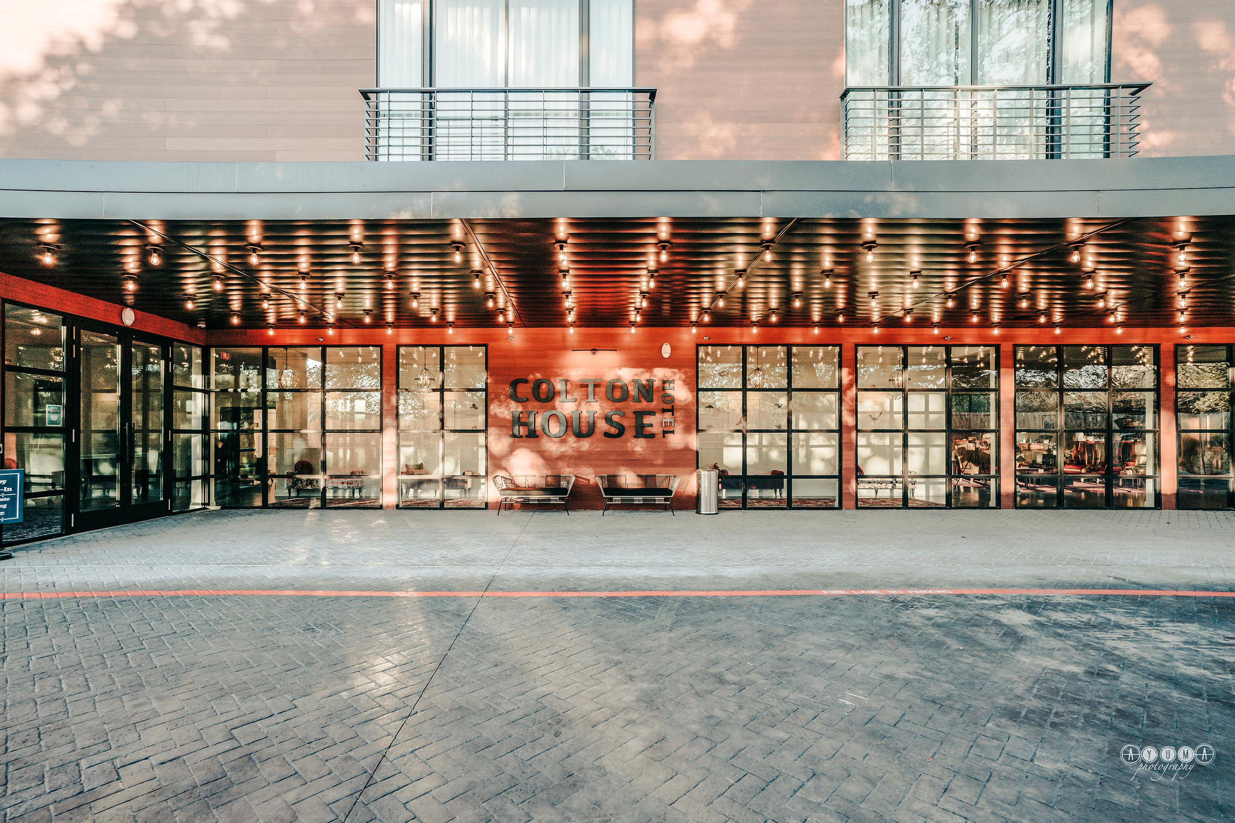 front entrance of hotel, marquee saying Colton House Hotel
