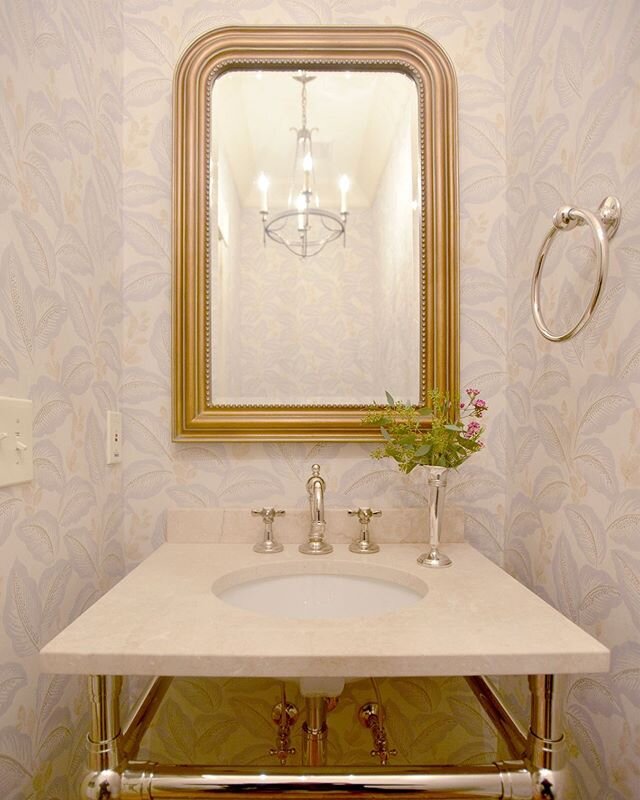 This sweet little powder room got even sweeter when we covered her in a vintage Sanderson wallpaper. Adding a washstand with classic polished nickel finishes was the perfect solution for a small space. We topped it off with one of our favorite Circa 