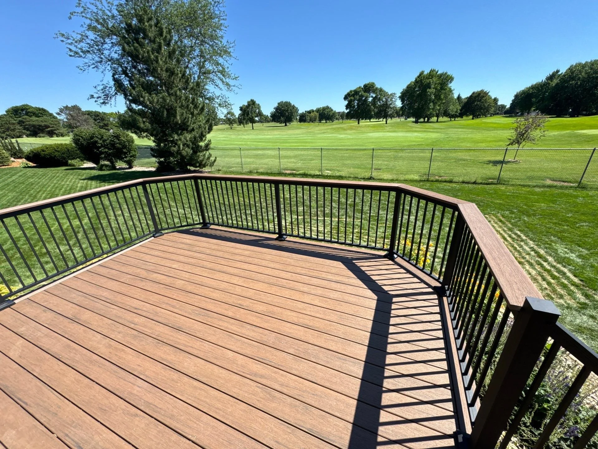composite deck with star black aluminum railing and integrated drink rail