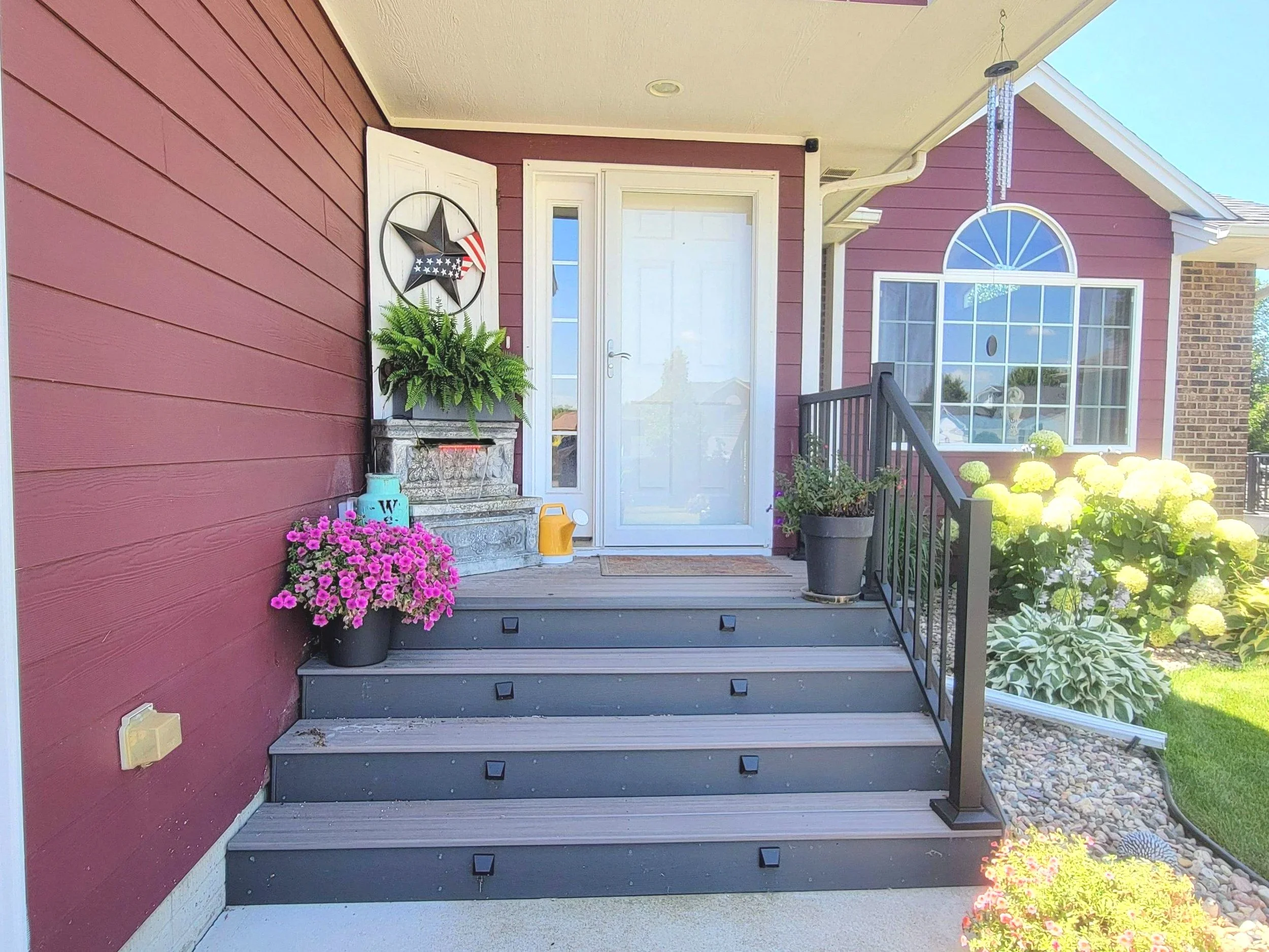 composite deck with black aluminum railing and integrated lighting