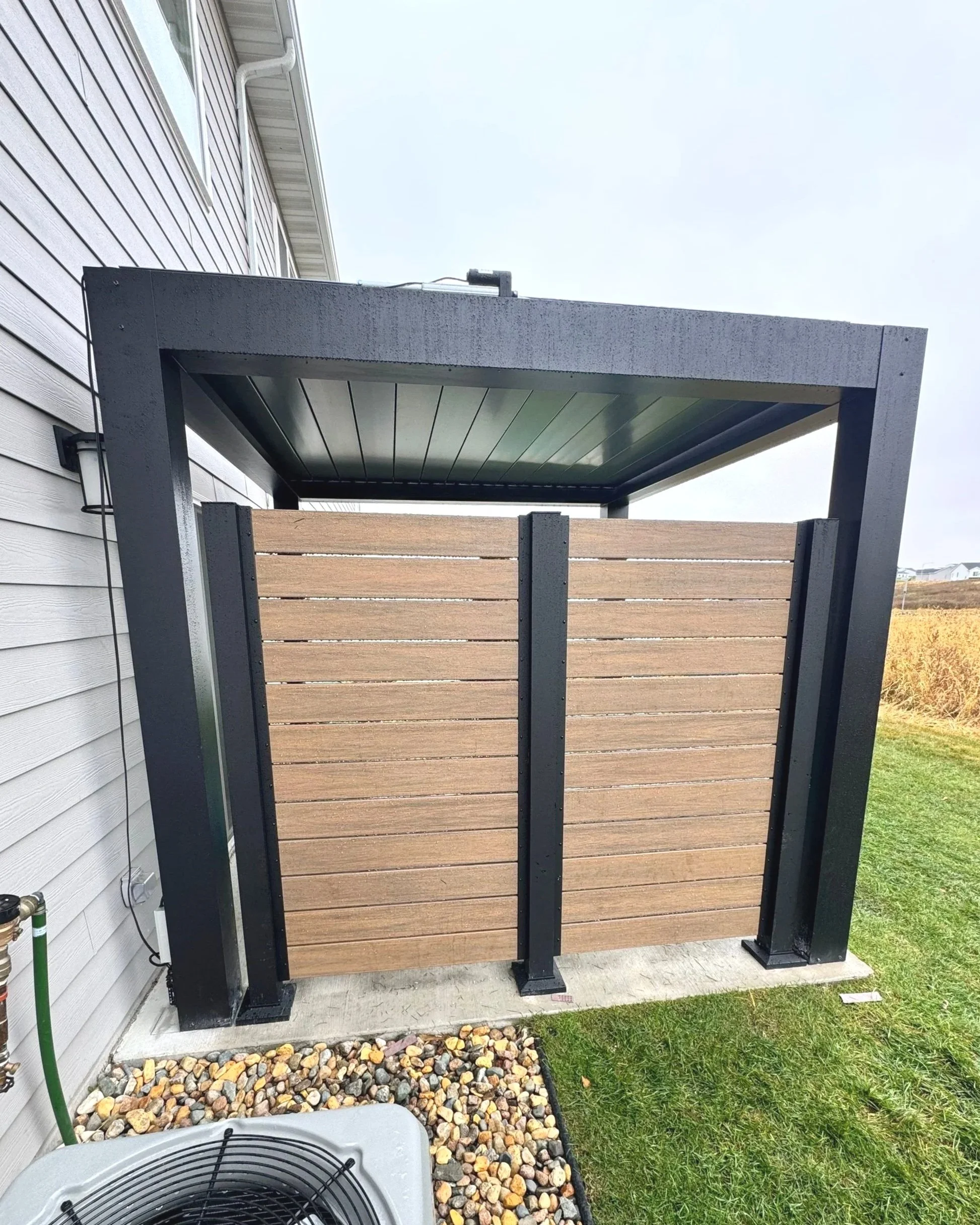 Metal pergola with star privacy railing including pvc deck boards