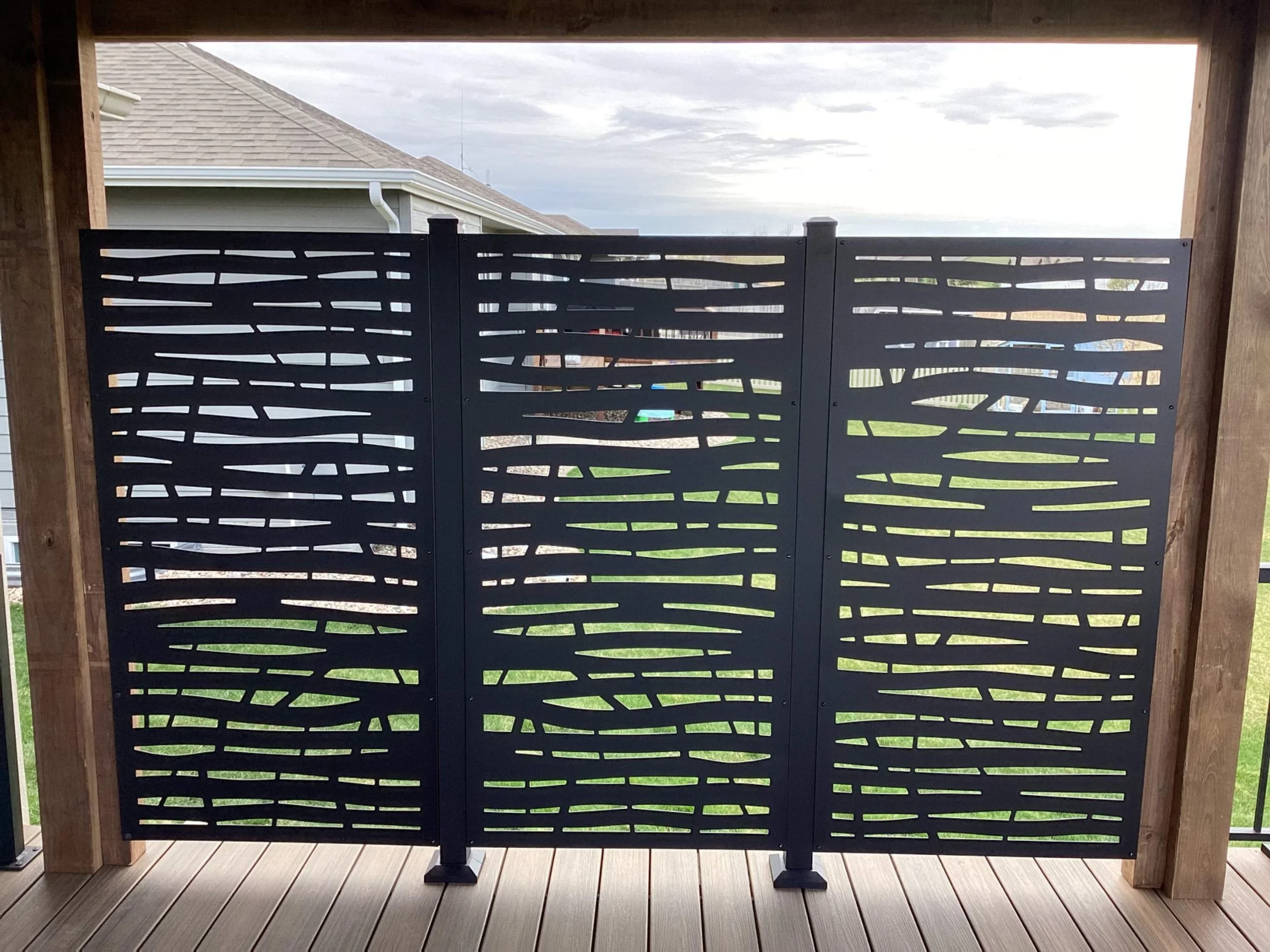 Composite deck with metal privacy wall