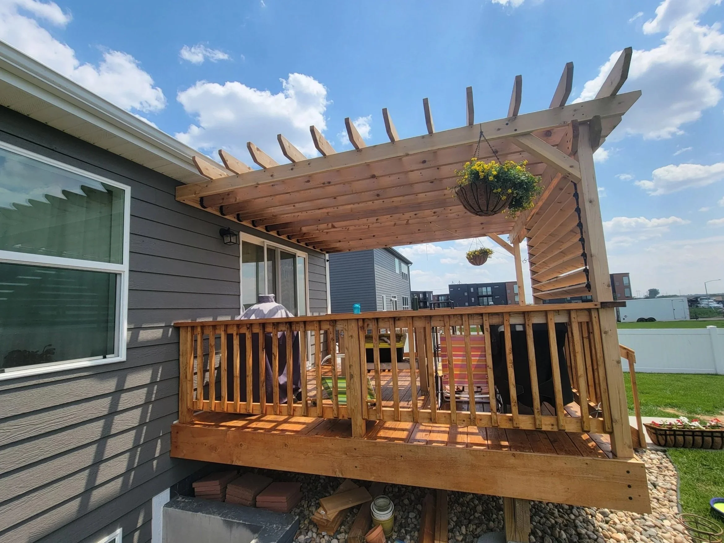 cedar pergola with cedar louvered wall