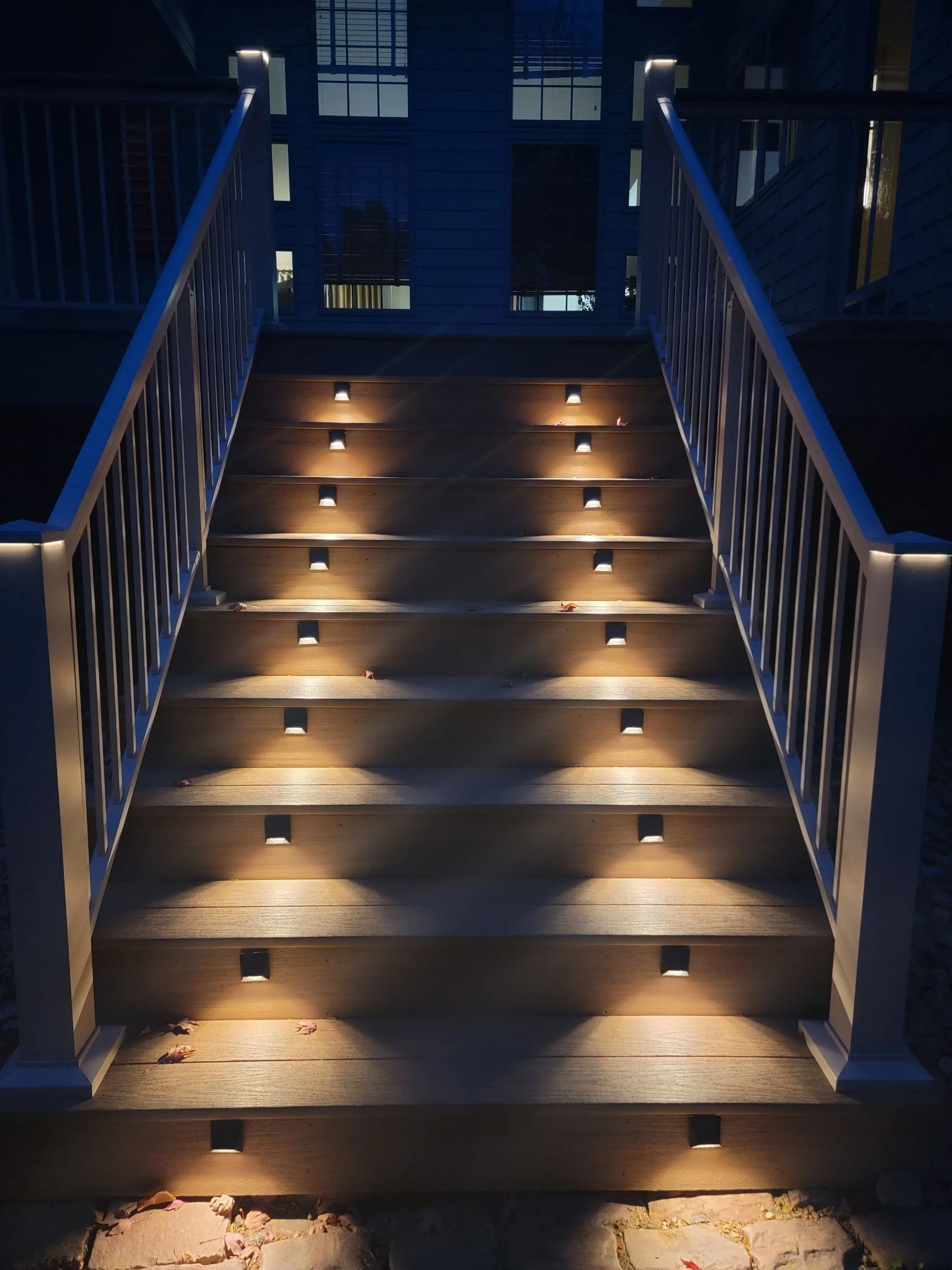 wplf pvc deck stairs with beige aluminum railing and integrated lighting