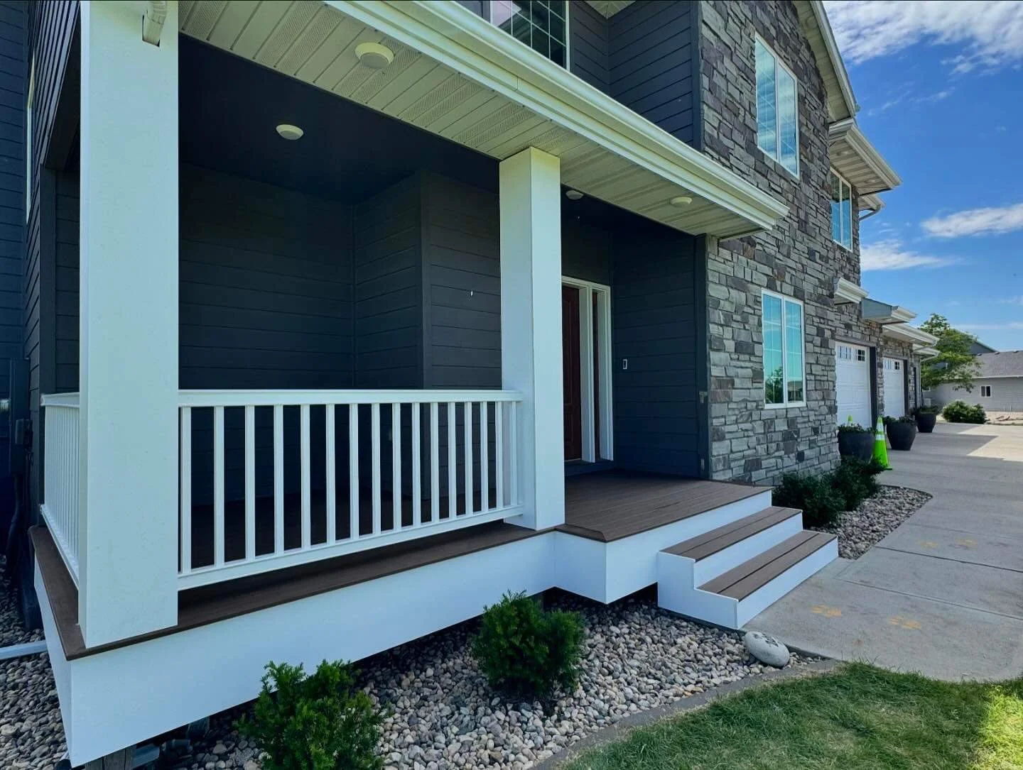 TimberTech composite deck boards and railing with white PVC trim