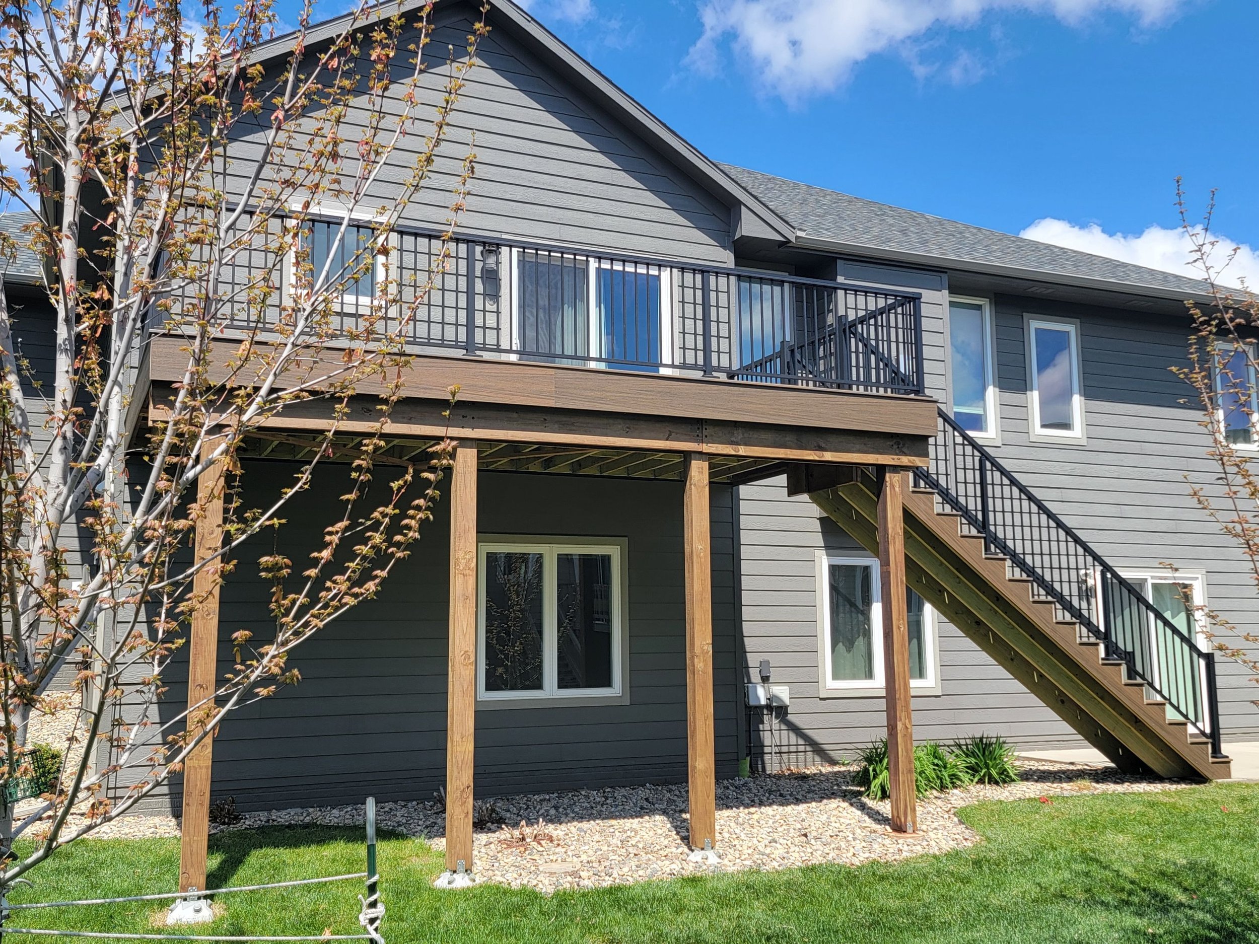 trex composite deck with composite fascia deck skirting and star black aluminum railing