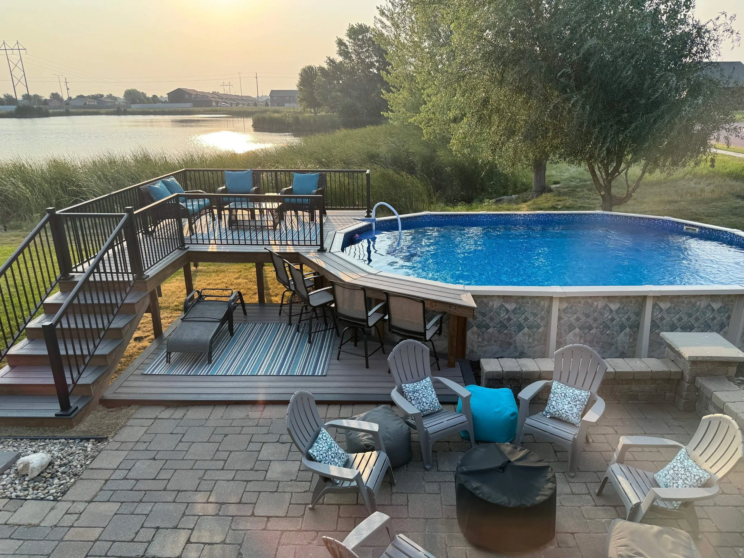 composite pool deck with bar and aluminum railing with an integrated gate