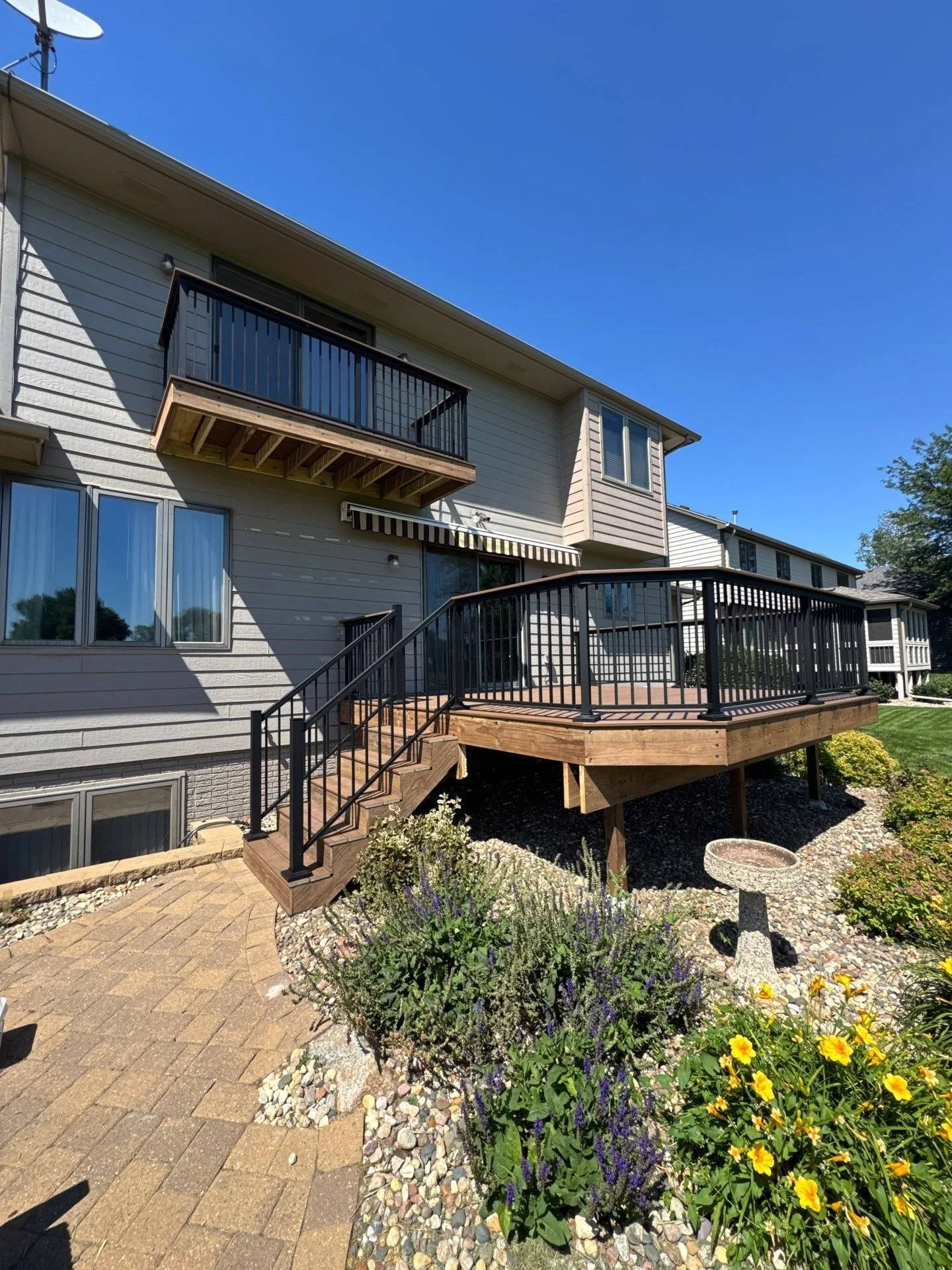 composite deck with star black aluminum railing and integrated drink rail