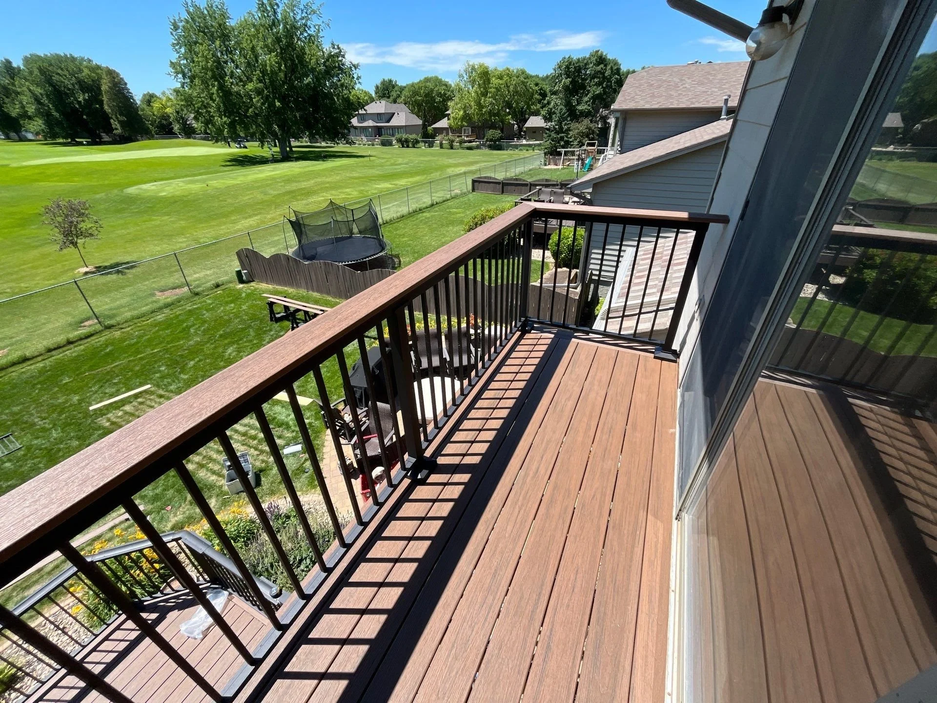 composite deck with star black aluminum railing and integrated drink rail