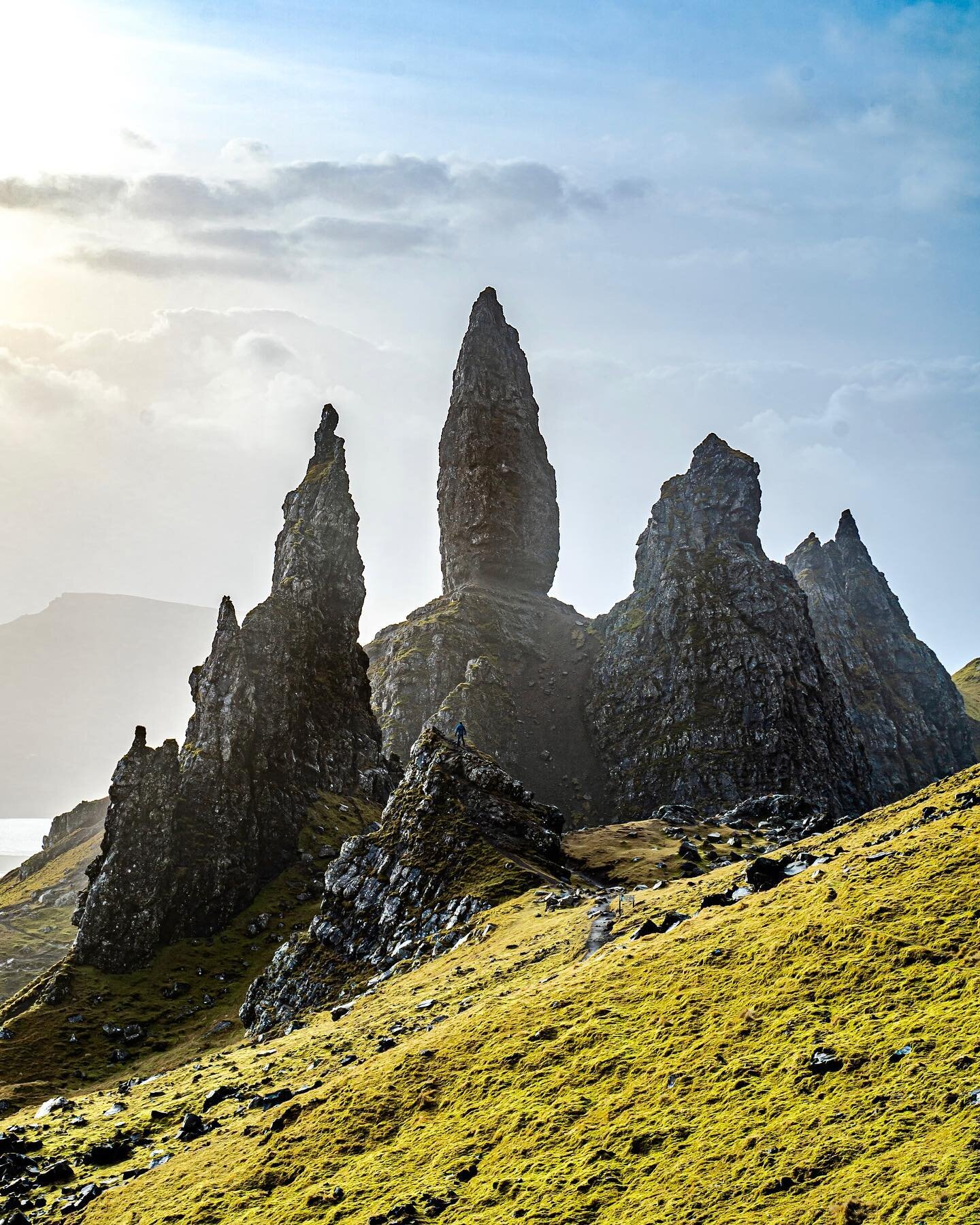 A windswept day at Storr.
Legend has it that the Old Man of Storr was a giant who had lived in Trotternish Ridge and when he was buried, his thumb was left jutting out of the ground, creating the famous jagged landscape.

Spot David trying not to get