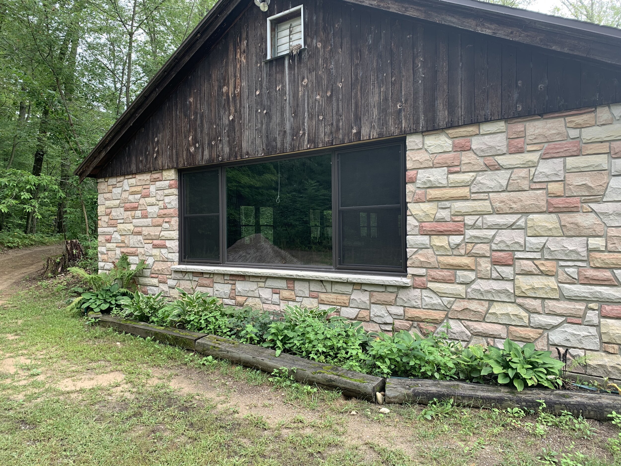 The stone facade of the Dining Hall is enhanced by the natural setting. 