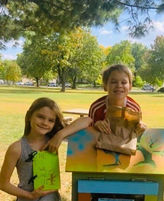 neighbor kids with their finished bark rubbing journals at Horton Park