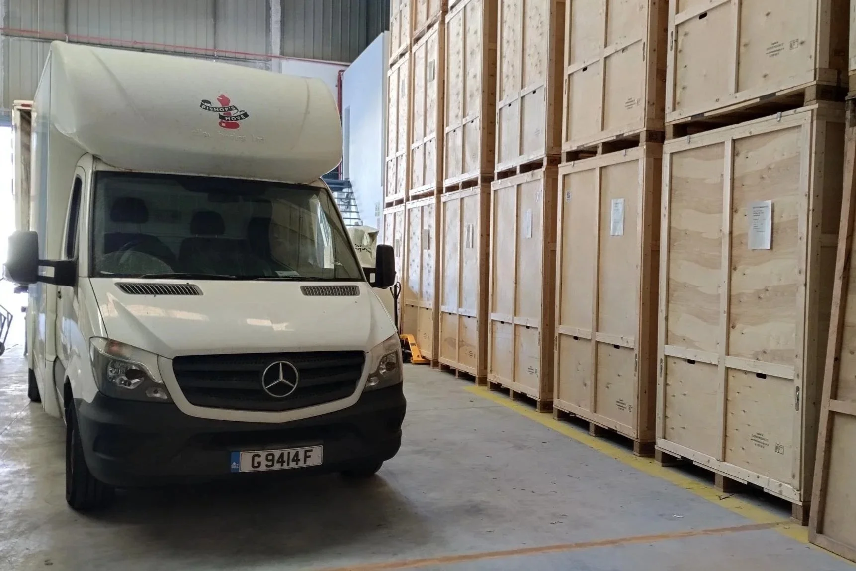 Removal van inside storage warehouse