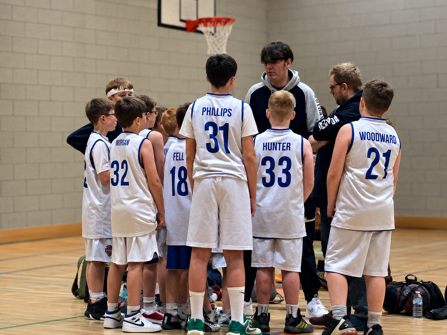 Great Yarmouth Basketball Club development team players in a team huddle.