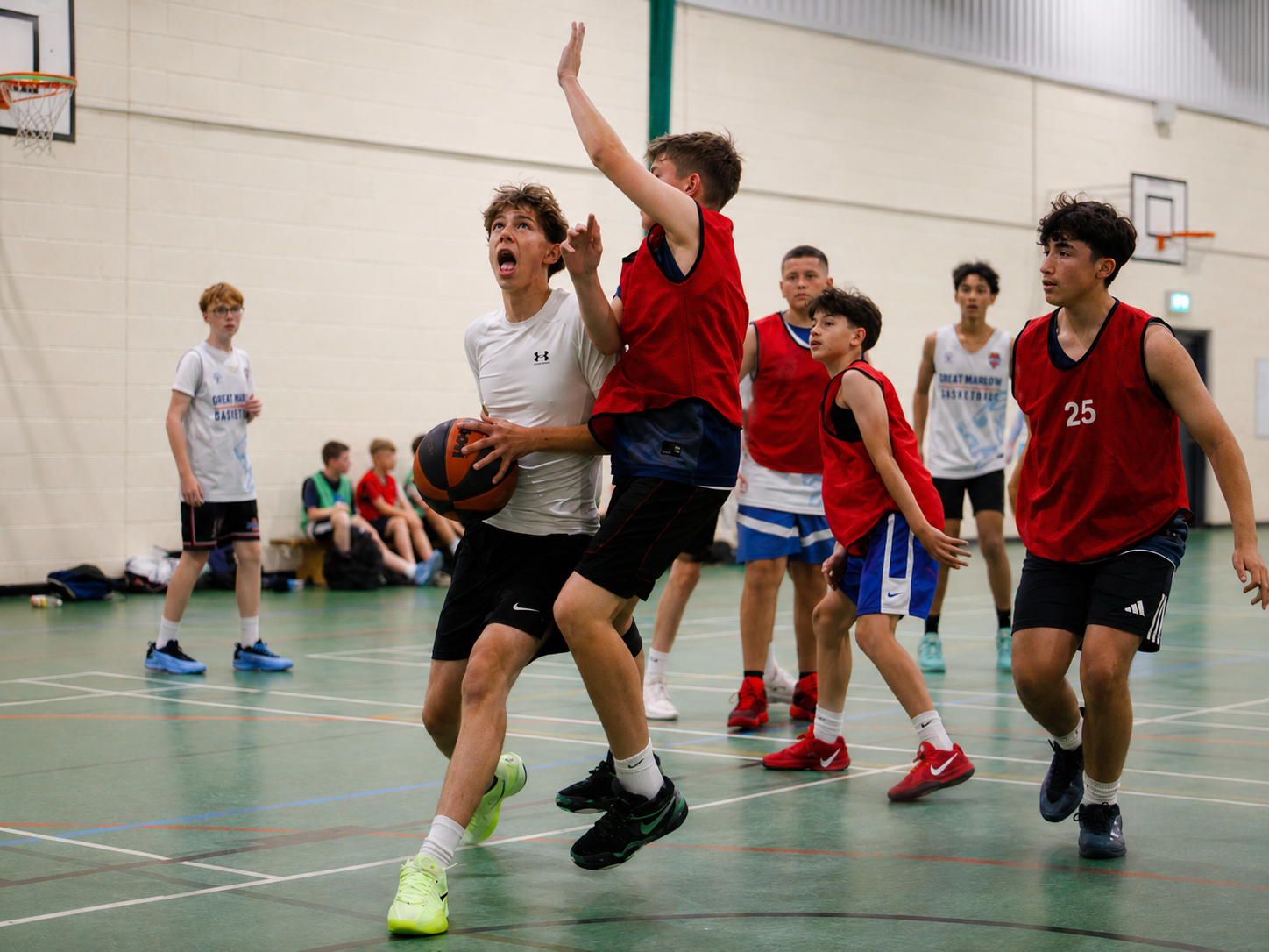 Junior basketball players competing during an open session at Great Yarmouth Basketball Club.