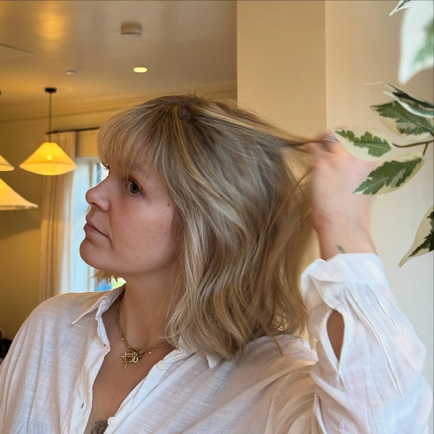 Golden Blonde &amp; Textured Cut 

We started by creating a soft golden blonde tone to brighten her overall look while keeping it natural and dimensional.

Next, we shaped the cut shorter with a touch of edge, tailored to her style and how she loves 