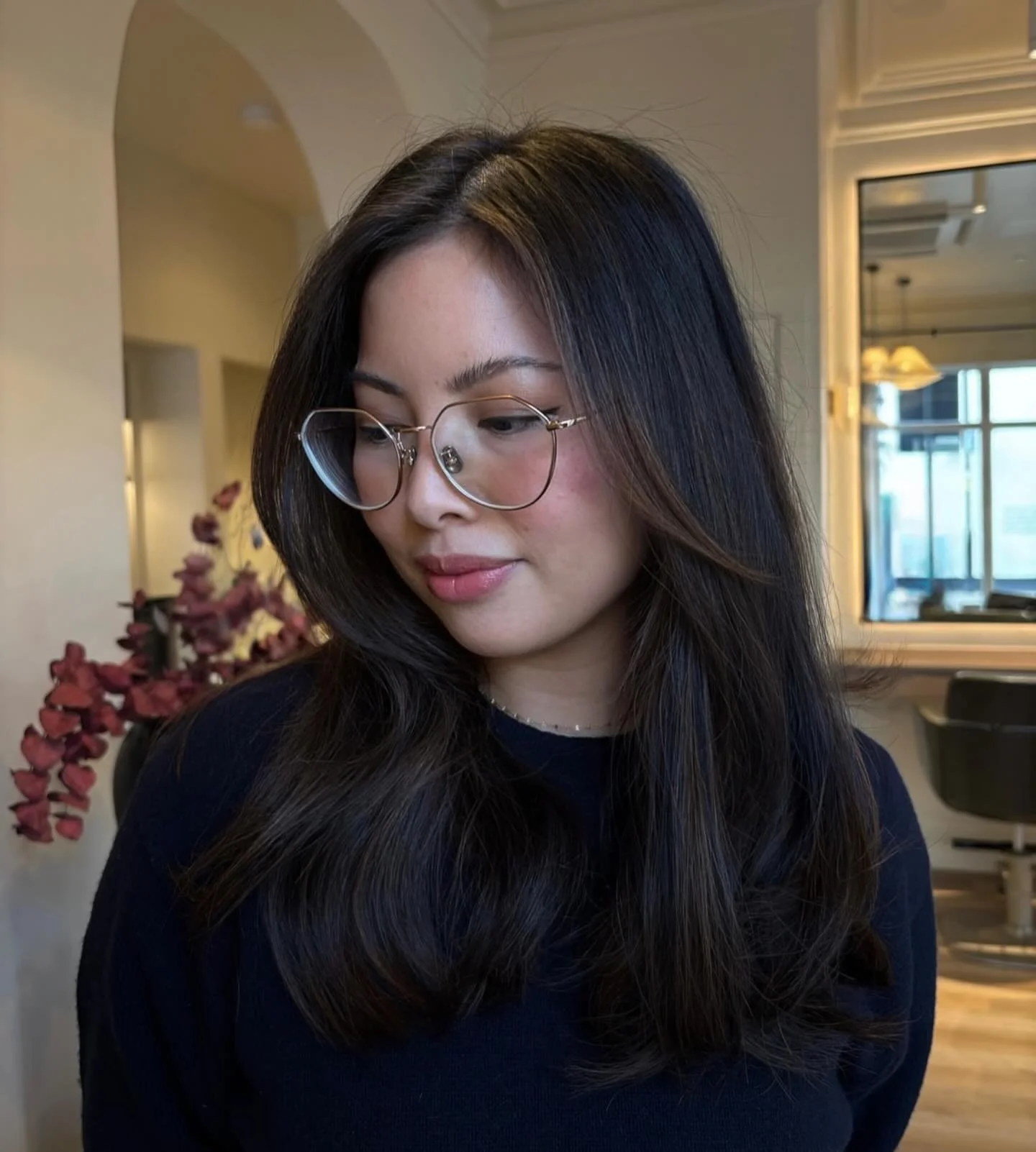 Back to balance.
Her colour had grown out unevenly, warm through the mid-lengths, flat at the ends. Instead of going dramatically lighter, we rebuilt the tone so it felt calmer, cleaner, and more polished.

A natural, cooler depth at the root to grou