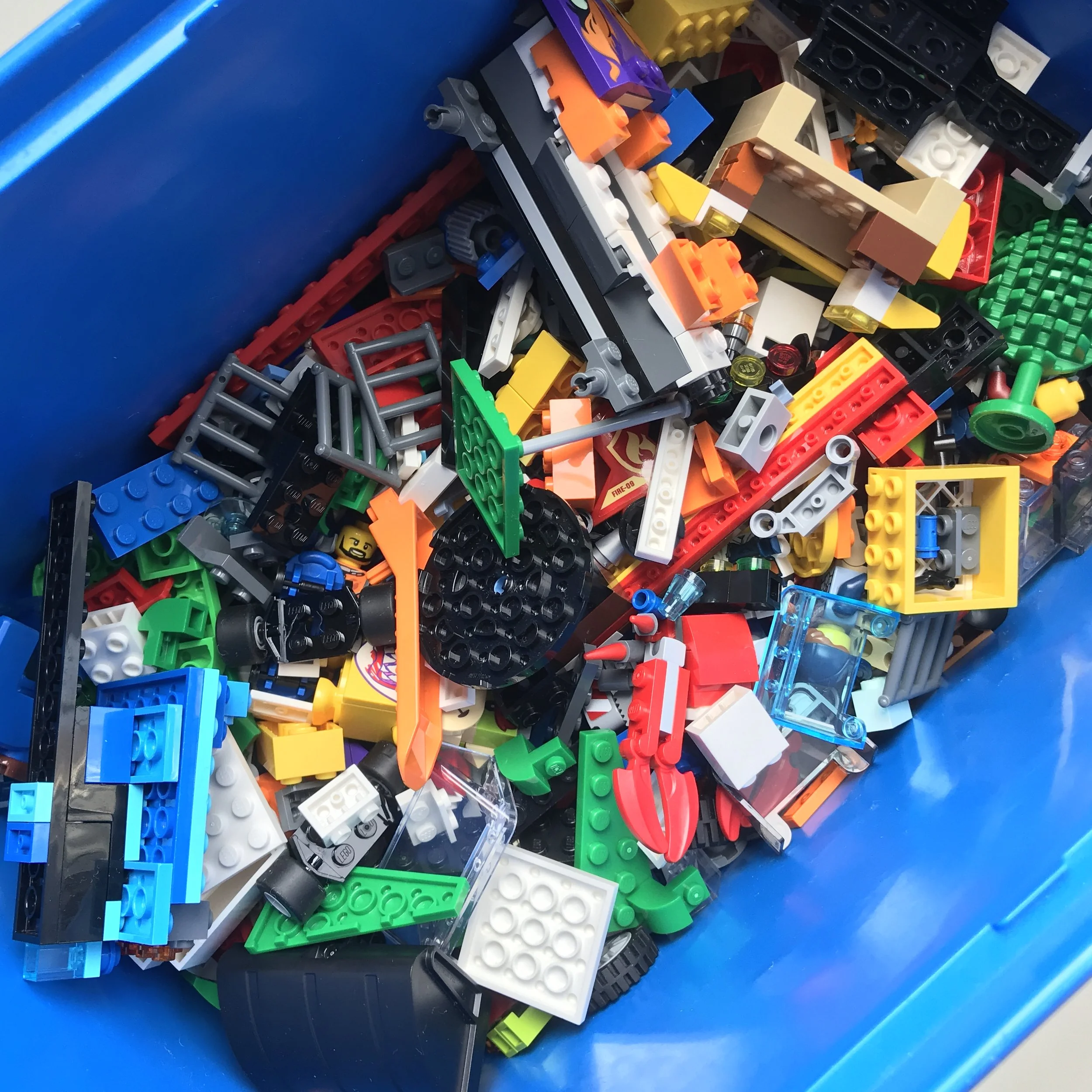 lego organized in storage bin