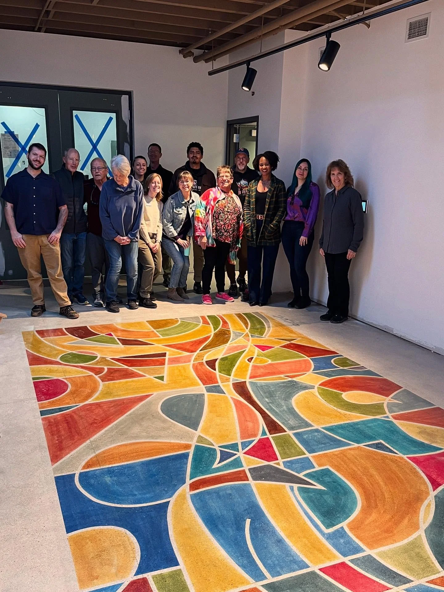 Today at our monthly meeting, the Greeley Creative District board got a sneak peek at the Greeley Creative Arts Center (GCAC) and the beautiful new floor mural painted by UNC educator and designer @samuel.o.dongsaul. 

We are so eager to welcome the 