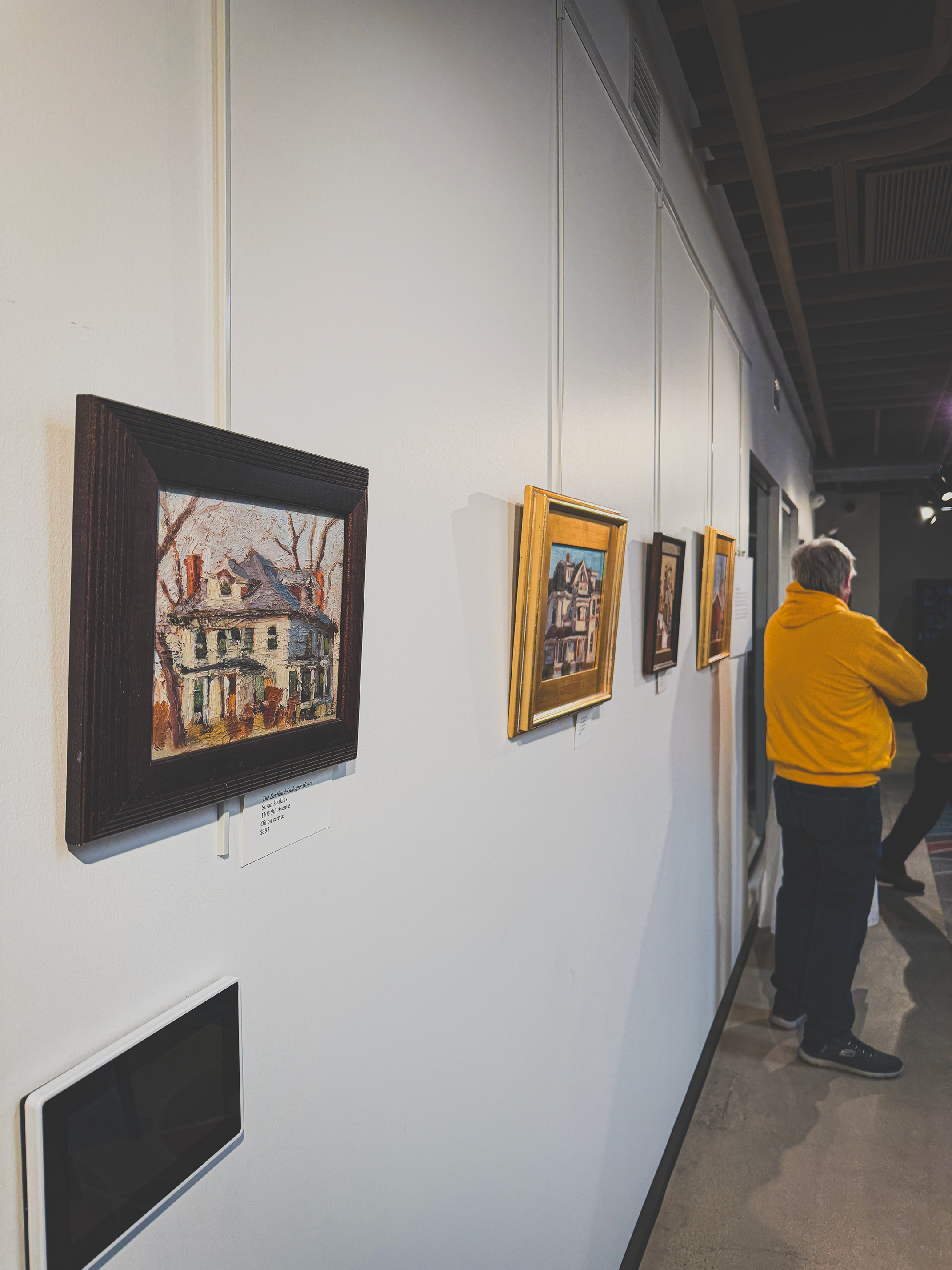  Framed paintings of buildings in Greeley hang in the Historic Preservation exhibition at the Greeley Creative Arts Center. 