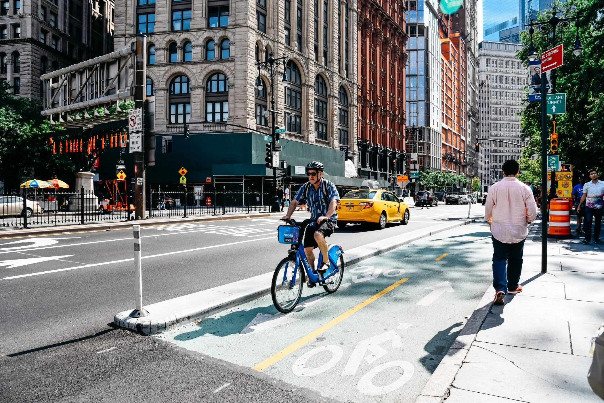 cyclist-riding-on-bike-lane-in-park-row-in-financial-district-new-york-city_t20_doZLGn.jpg