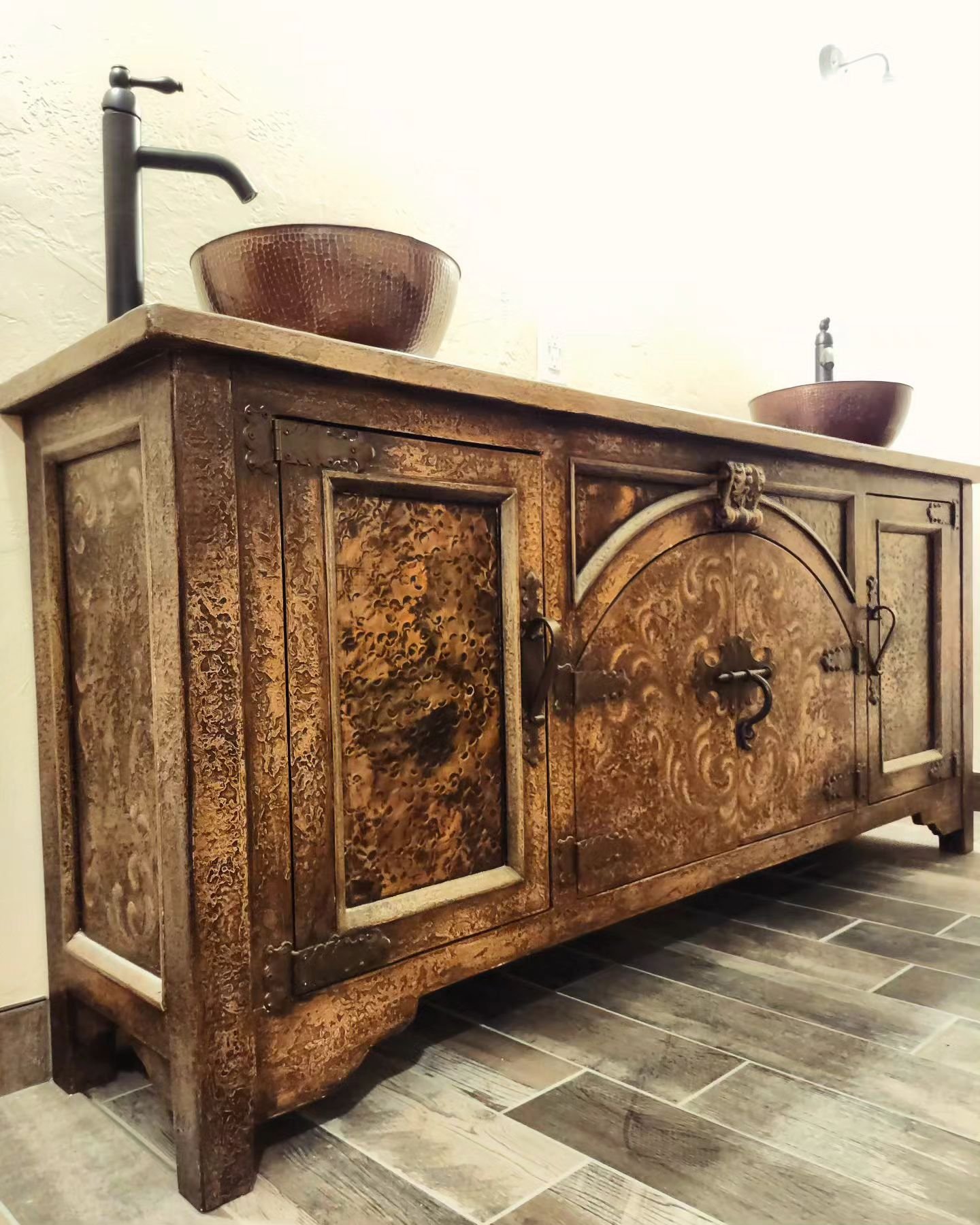 Favorite vanity installed to date👌
.
.
This is a hand carved antique buffet fabricated to fit as a fully functional vanity with copper vessel sinks. Hands down my favorite way to add a one of a kind repurposed statement piece.

#BathroomsofInstagram