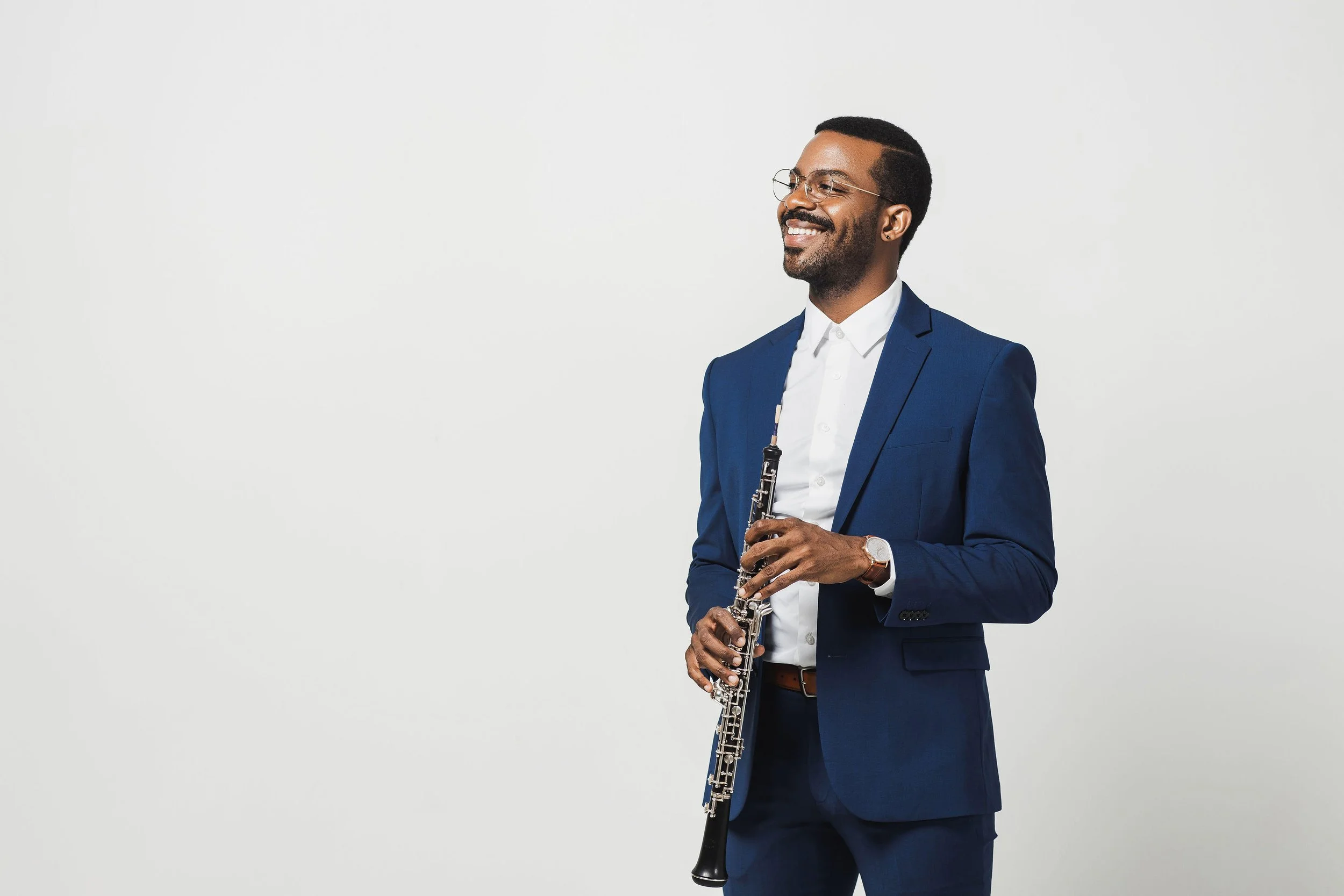 Titus Underwood headshot with oboe