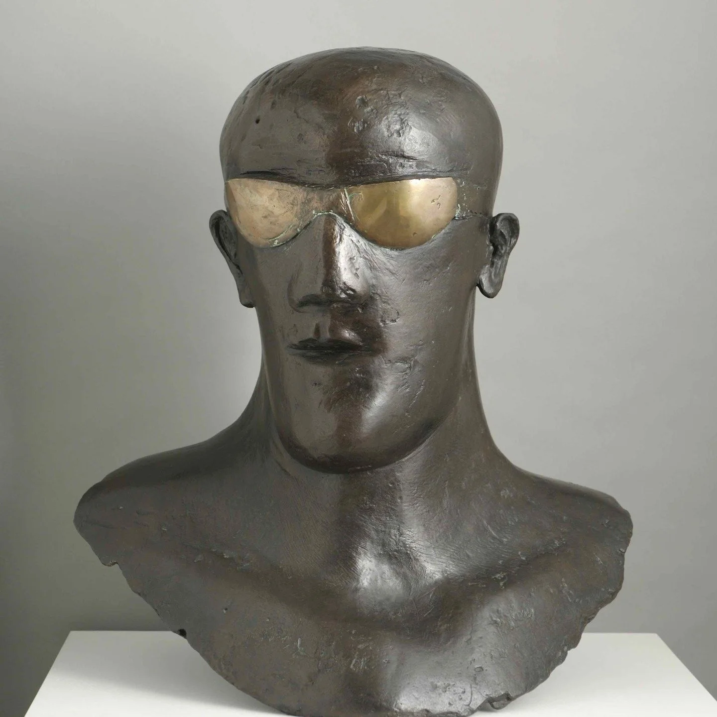 This face made me stop the first time I saw it, and feels ever more relevant today.. 

Elisabeth Frink made her Goggle Head series in the late 1960s after seeing a single photograph in a newspaper (which I think I have found, last image). The man in 