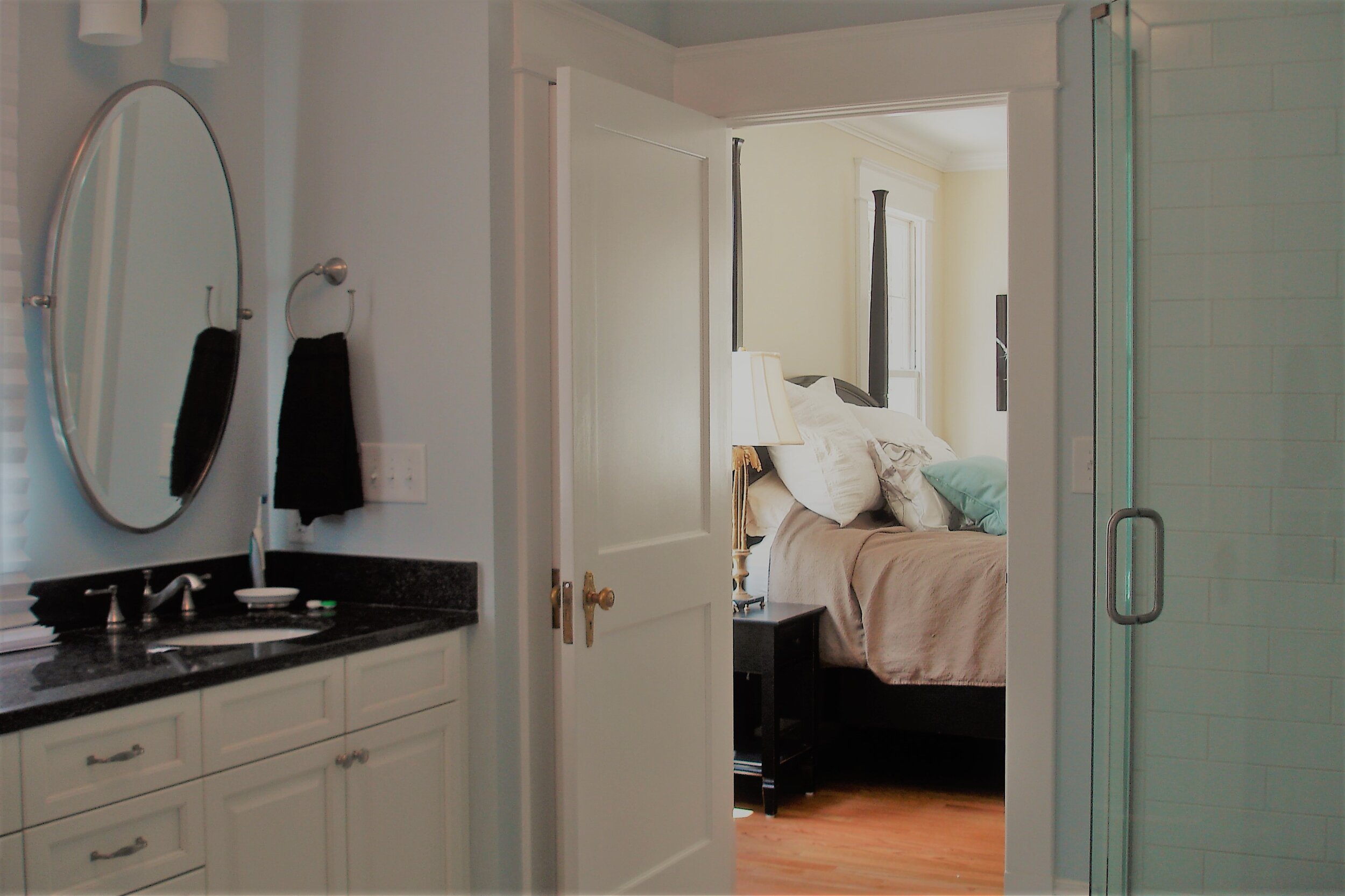 The large master bath includes a spacious vanity with a window and a large walk in shower