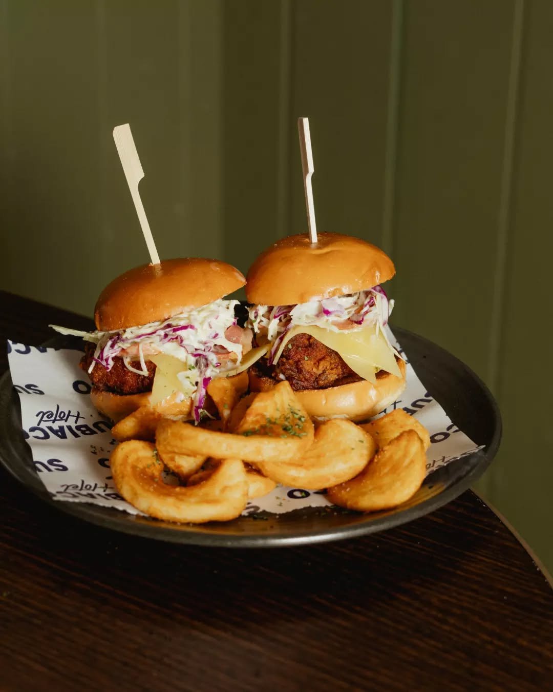 Not your average slider! Two perfectly crisp chicken brioche buns layered with cheddar, bacon, honey sriracha &amp; slaw, served with sidewinders for the ultimate finish&nbsp;✨

For bookings at the Subi head to the link in our bio.
