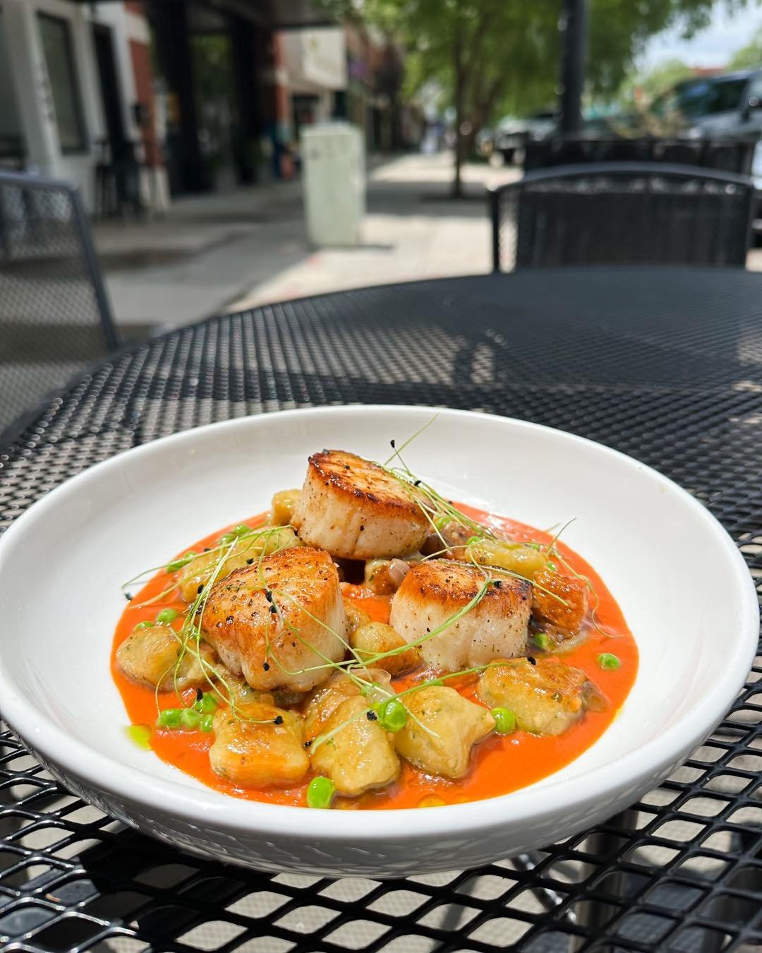 Embark on a culinary adventure with our weekend special: Yucca Gnocchi and Seared Scallops! 🍴✨ Indulge in the perfect blend of flavors, from the richness of the seafood saffron ala vodka sauce to the freshness of the spring peas. Don't miss out on t