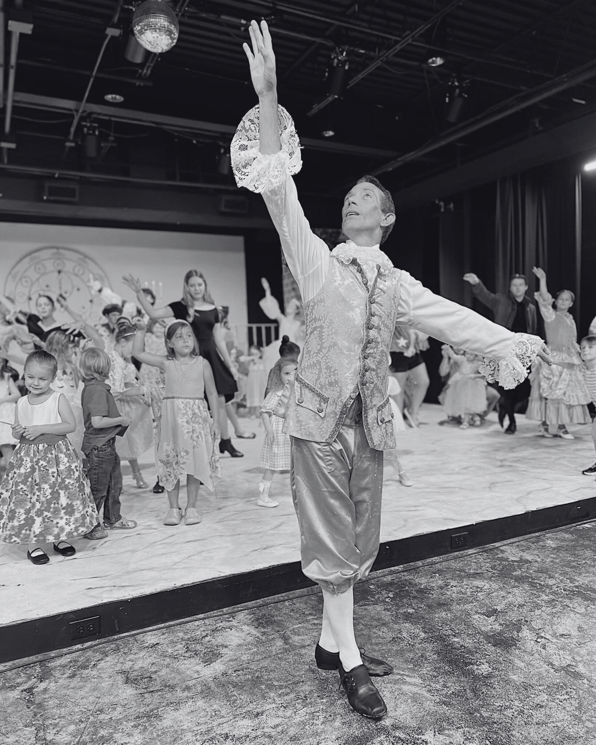 Kristian Ameigh, director of Batesville Community Theatre’s Cinderella, teaches children a waltz sequence at the Cinderella Tea Party event.