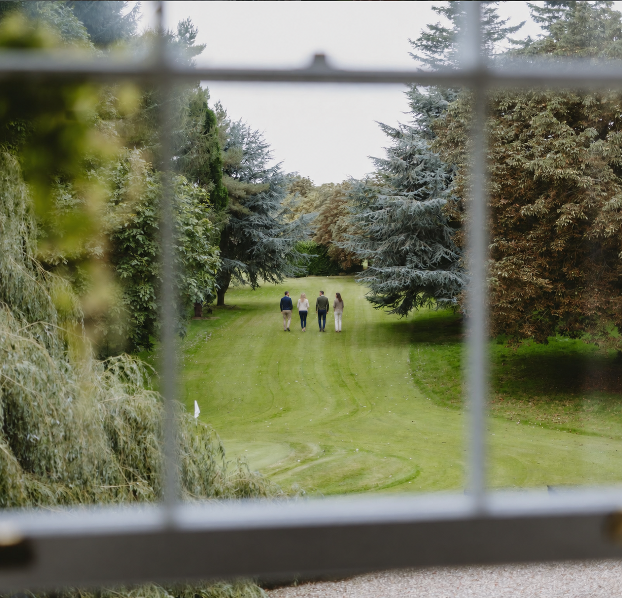 Four colleagues strolling on the fairway.png