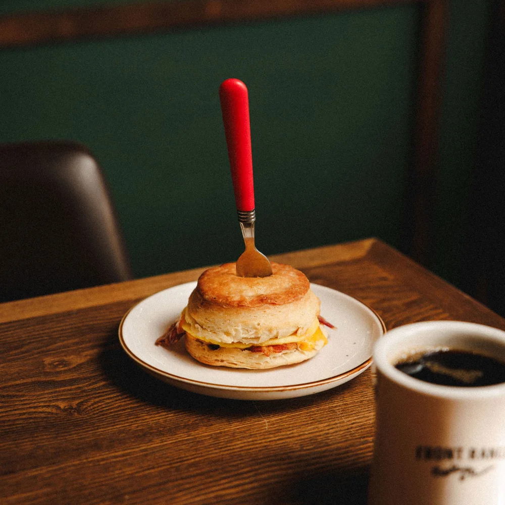 A bacon biscuit sandwich and coffee at Front Range KC