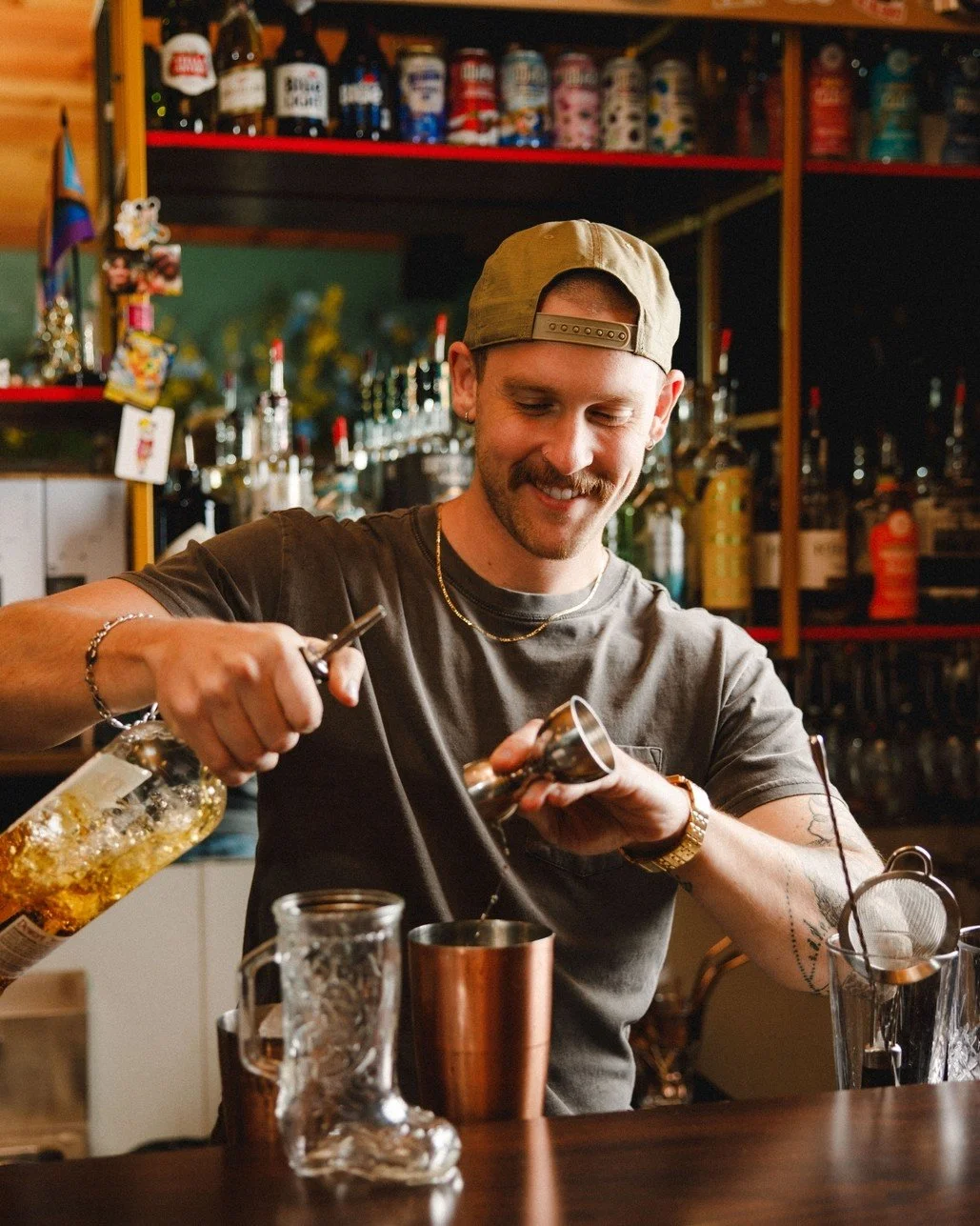 This is what we call service with a smile😏 Hang out with Adam at the Fairway location bar! Watch Bob Ross paint while you sip on a Happy Trees or Little Accident 🎨