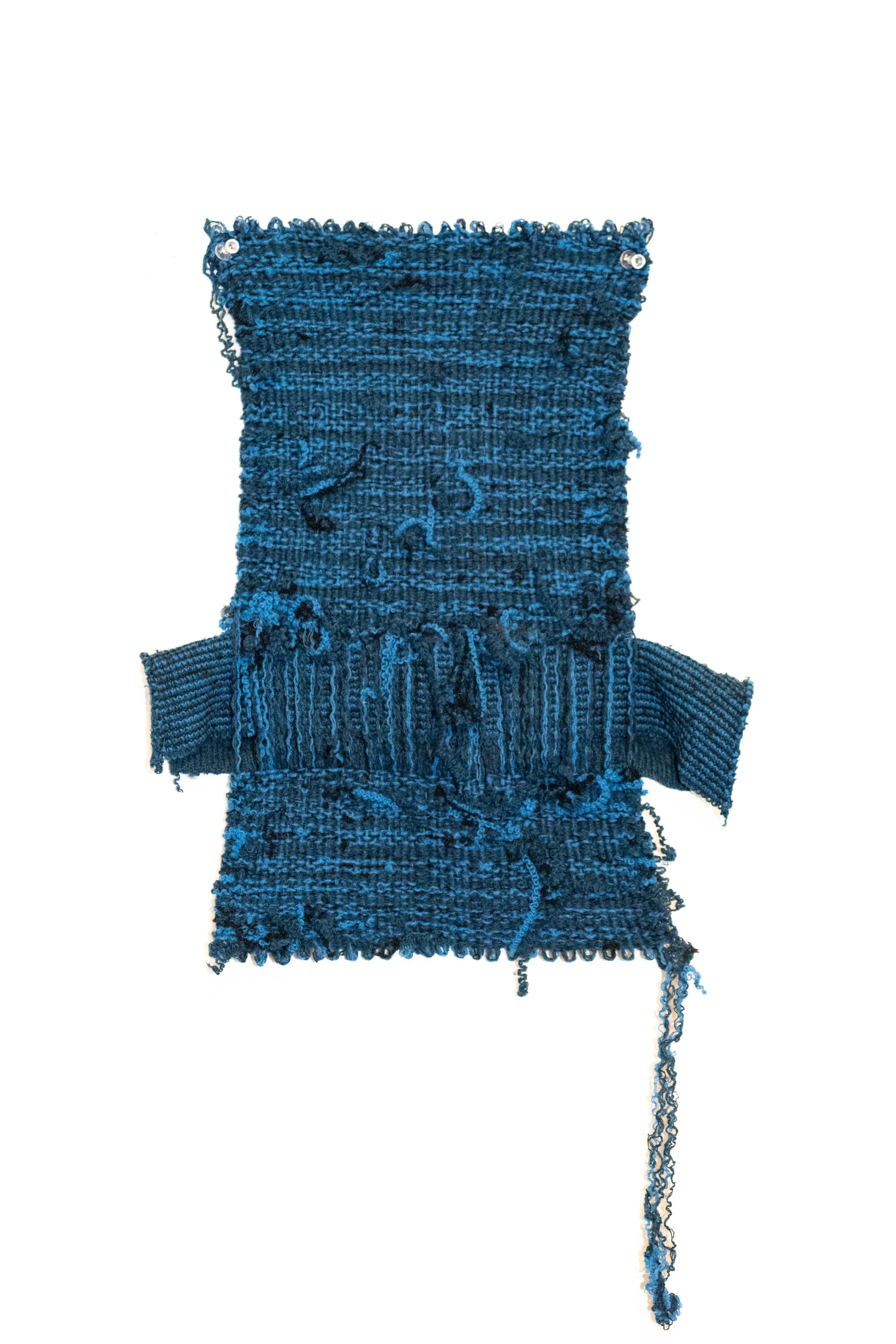 Small scale handwoven artwork made from Bibbs's grandfathers blue sweater