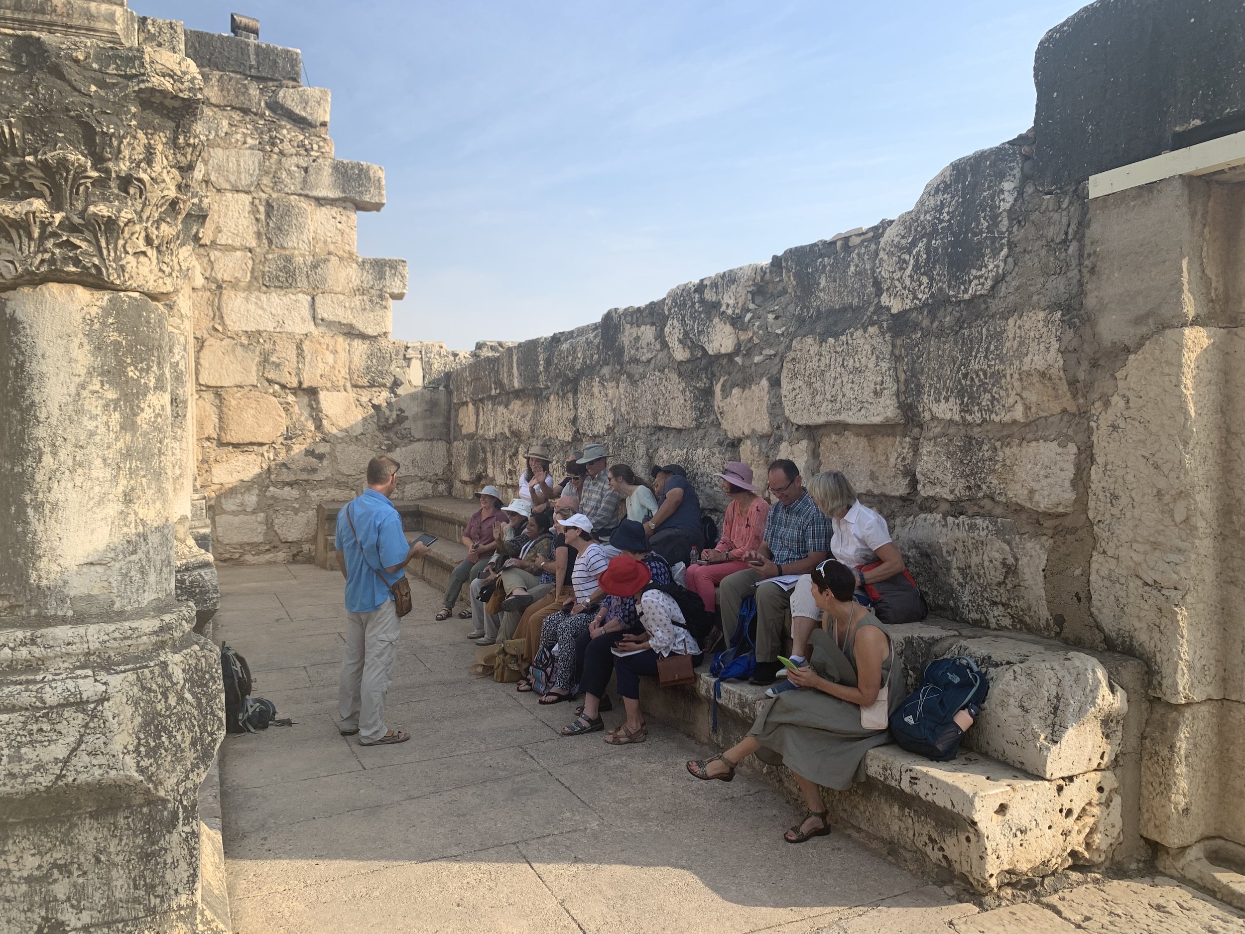 Bob teachingin the ancient synagogue of Capernaum, Footsteps of Jesus Experience