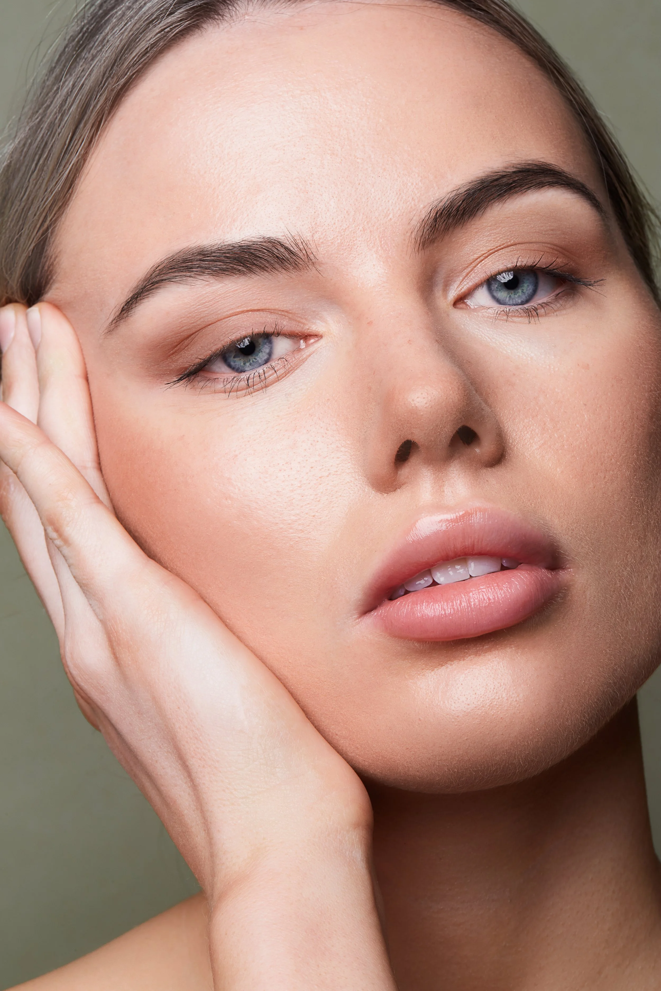 Close-up of a person touching their face